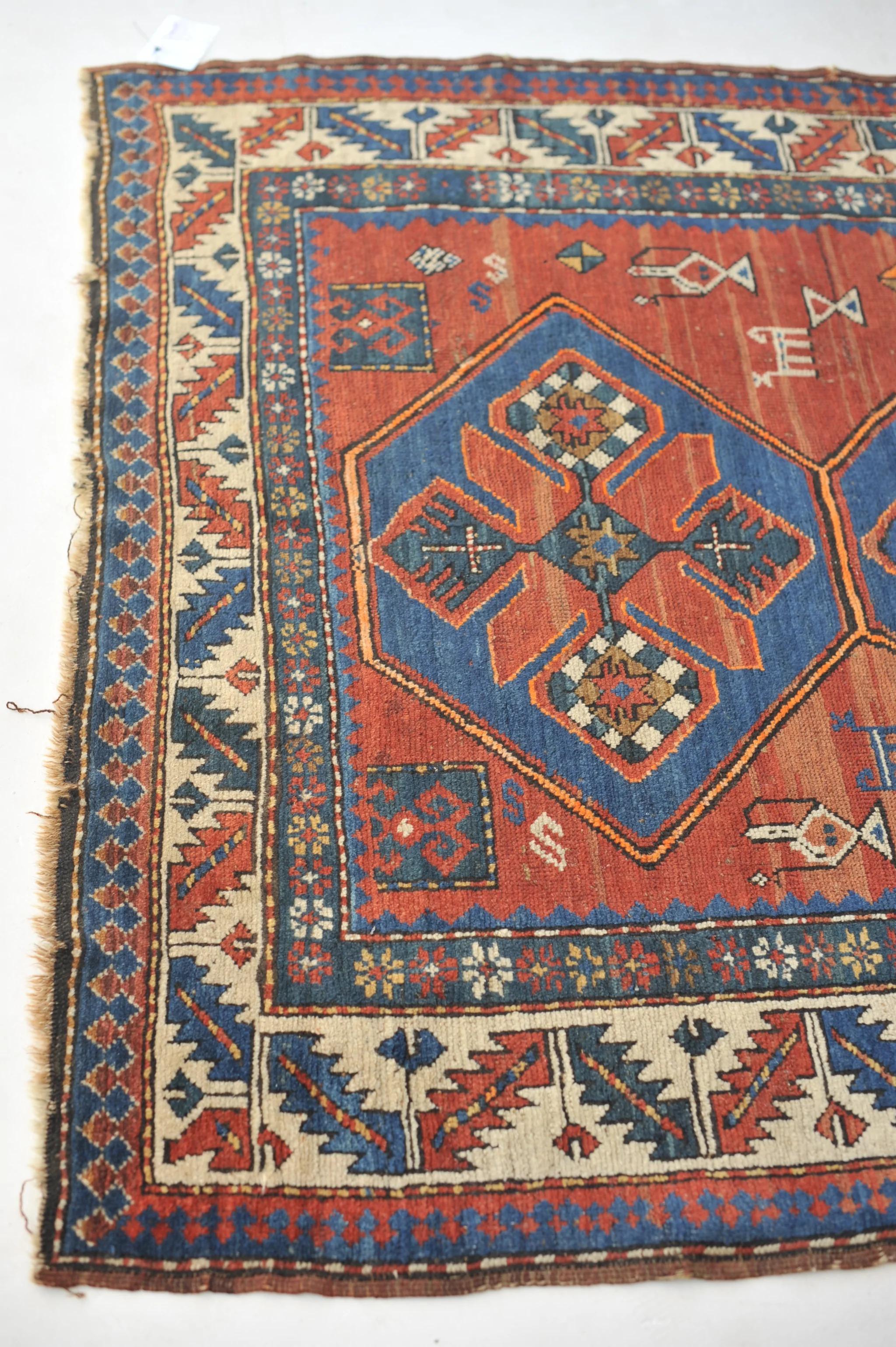 Wool Antique Kazak Tribal Rug with Variations of Clay, Rust, Autumn For Sale
