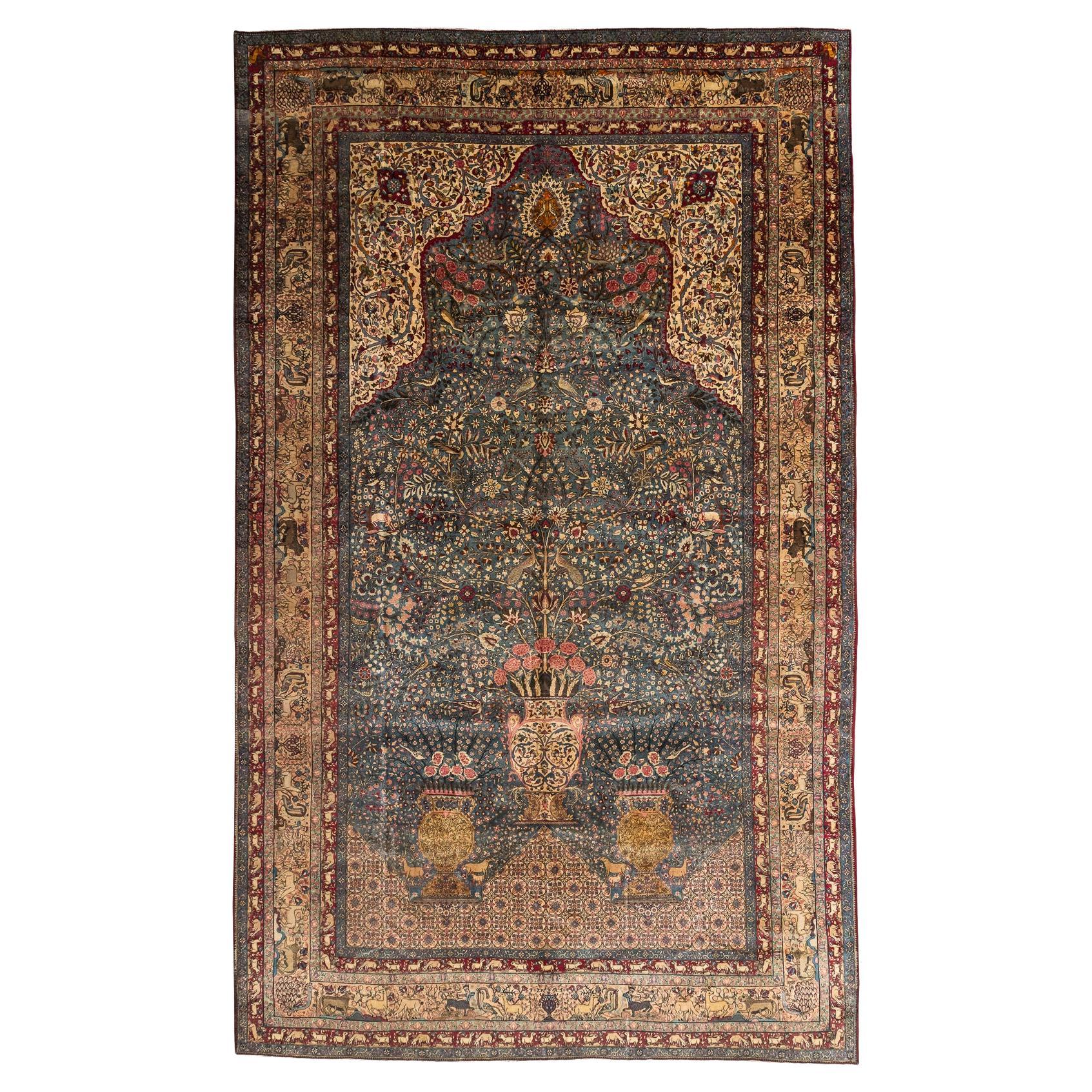Kerman – South Persia

A magnificent Kerman rug with a paradise design of palatial proportions. It features infinite birds and animals among a profusion of trees, flowering plants, and three large vases with roses. This Kerman has a vibrant colour