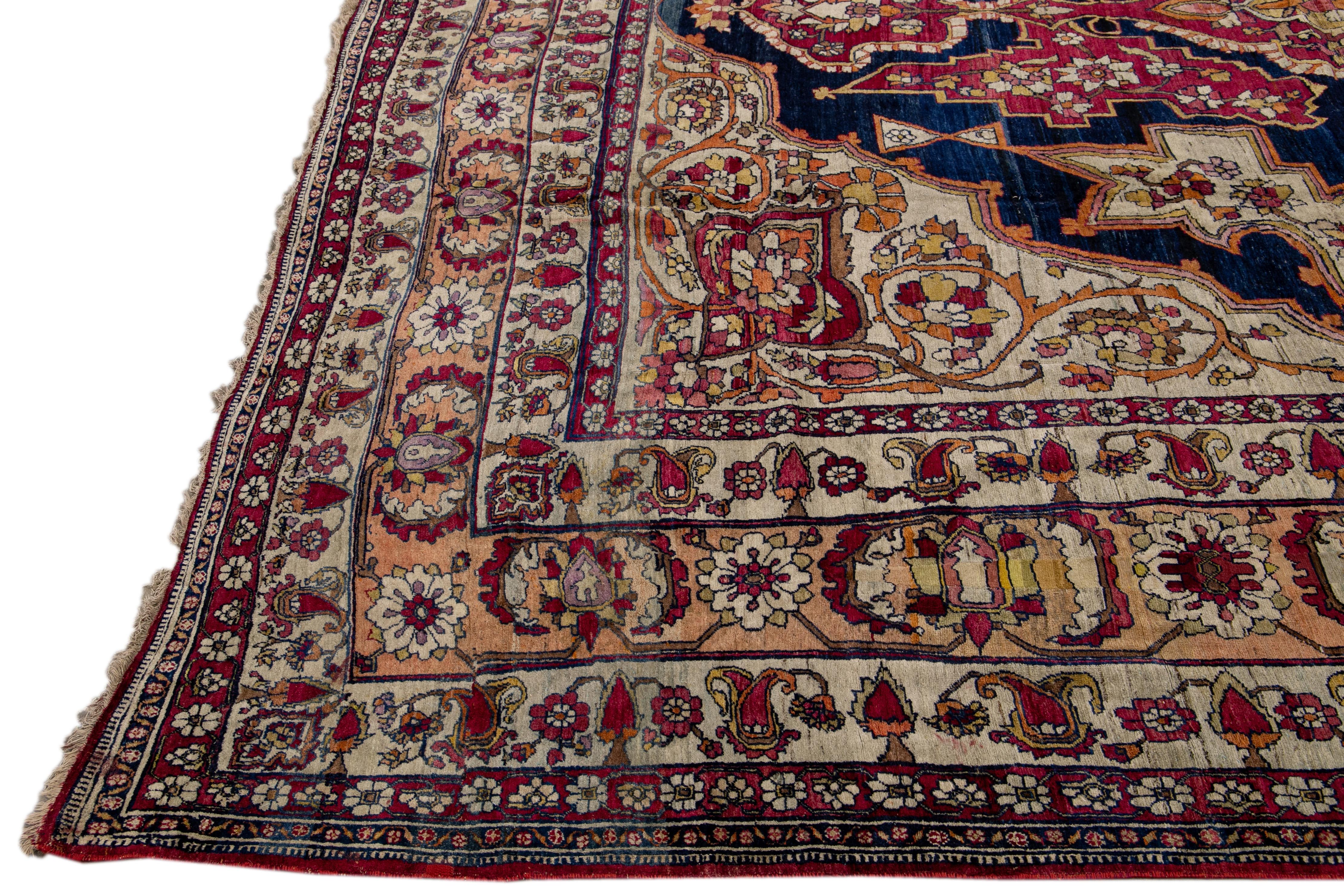 Persian Antique Kerman Handmade Red and Blue Floral Medallion Motif Wool Rug For Sale