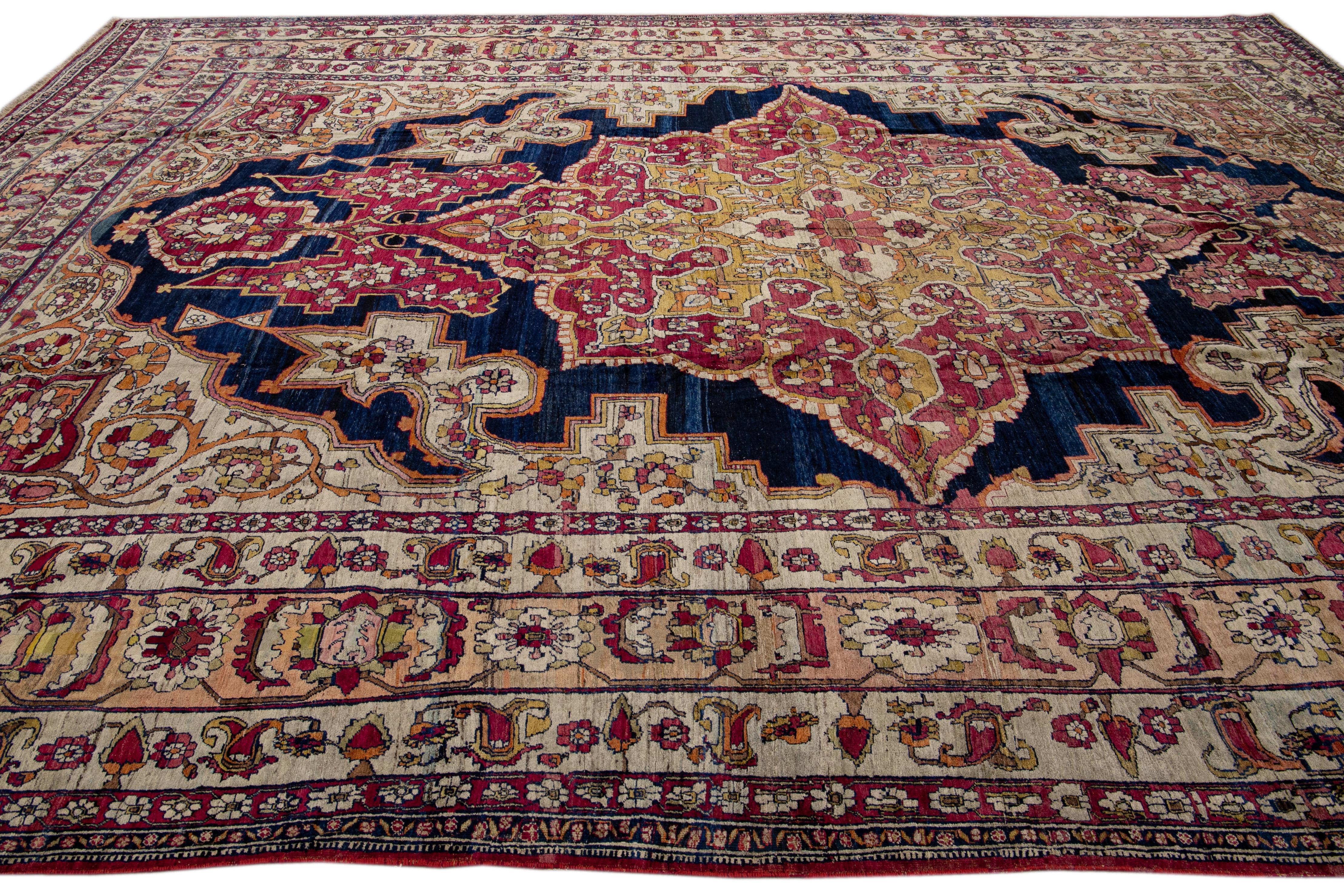 Hand-Knotted Antique Kerman Handmade Red and Blue Floral Medallion Motif Wool Rug For Sale