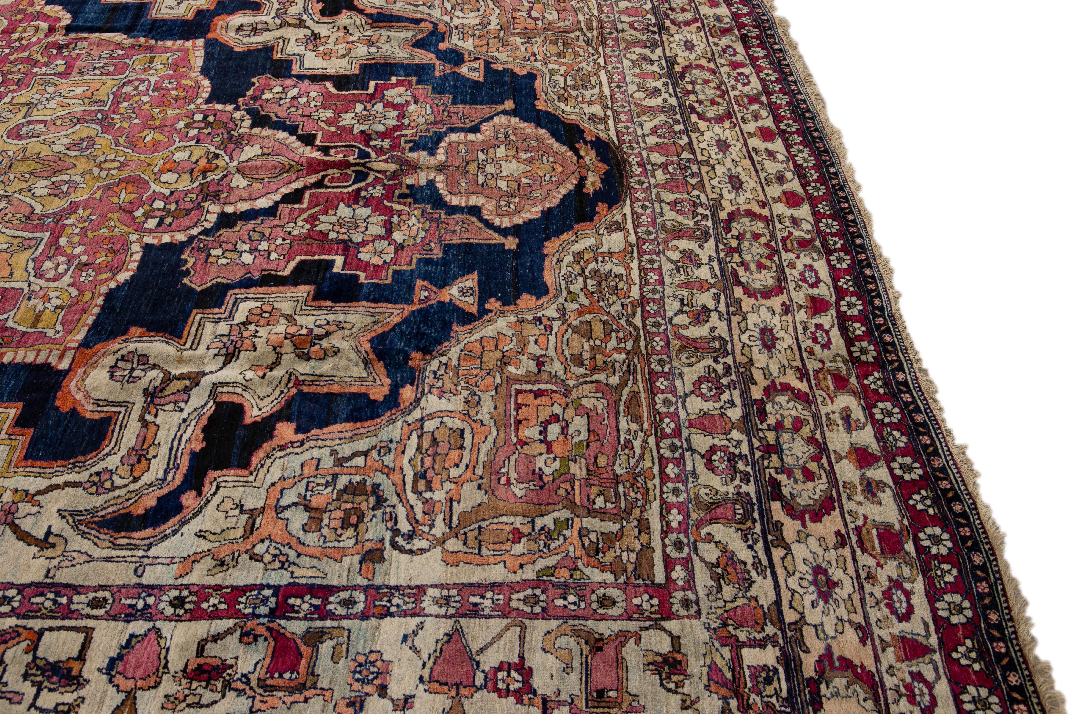 Antique Kerman Handmade Red and Blue Floral Medallion Motif Wool Rug In Good Condition For Sale In Norwalk, CT