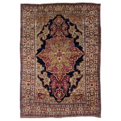 Antique Kerman Handmade Red and Blue Floral Medallion Motif Wool Rug