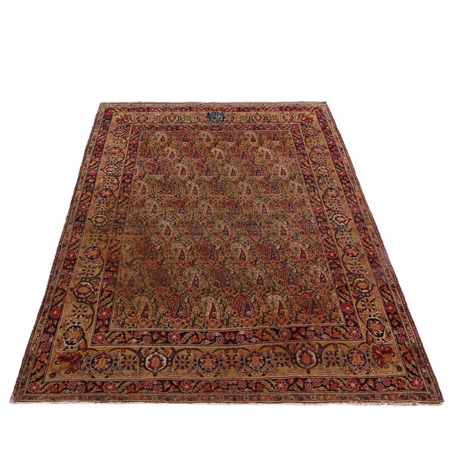Hand knotted in high-quality wool originating from Persia in 1890, this antique Kerman Lavar rug hails from one of the most acclaimed cities of antique rug creation in several centuries, enjoying a distinct pair of sharply stylized boteh (paisley)