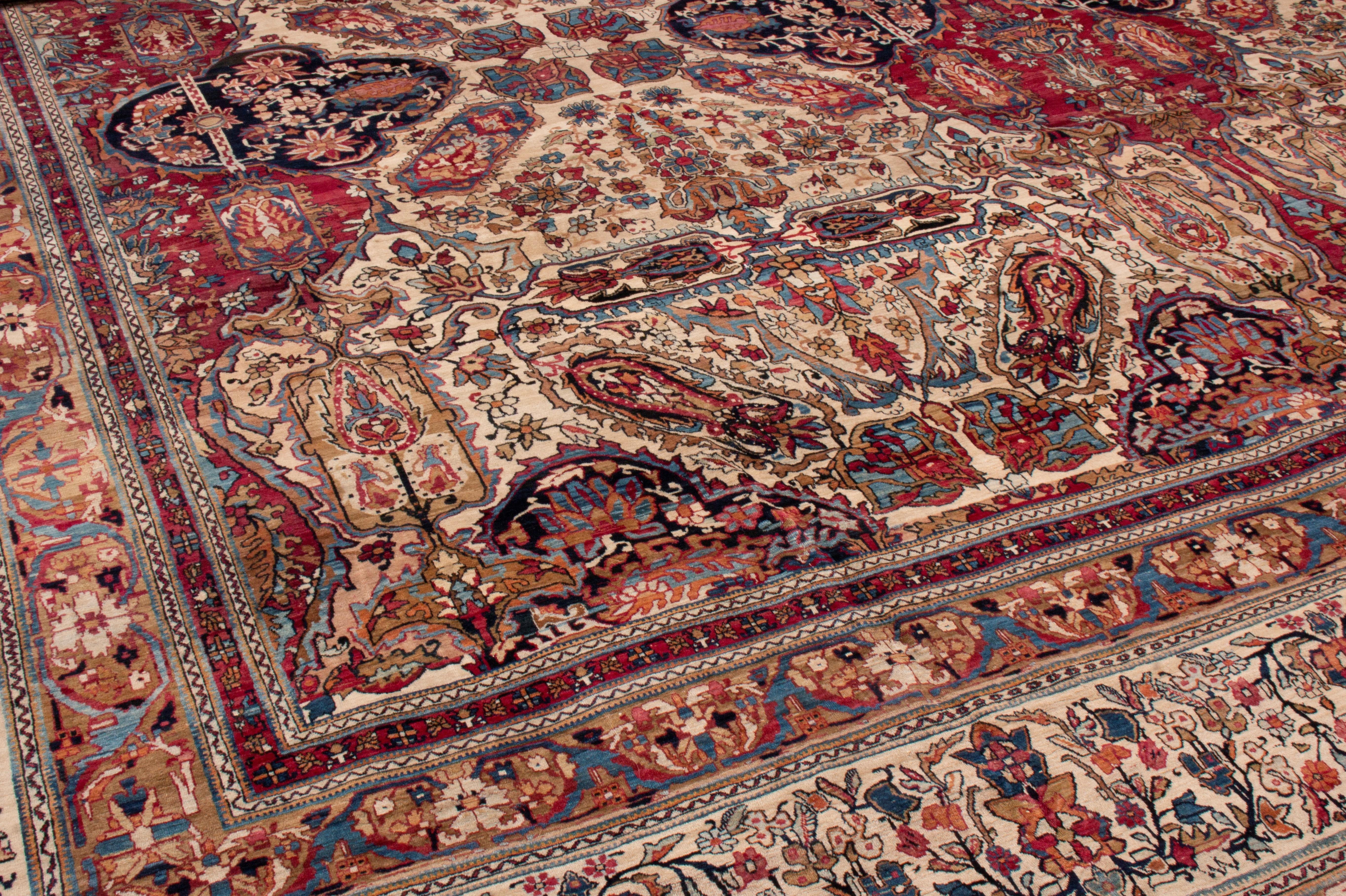 This antique Kerman Lavar Persian floral rug has a unique orientation in its field. From 1880-1900, the graph of the all-over floral field was drawn off-centre, an exceptionally uncommon trait for Kerman Lavar rugs that typically favor centric