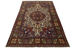 Antique Kerman Persian Beige Wool Rug with a Rosette Design