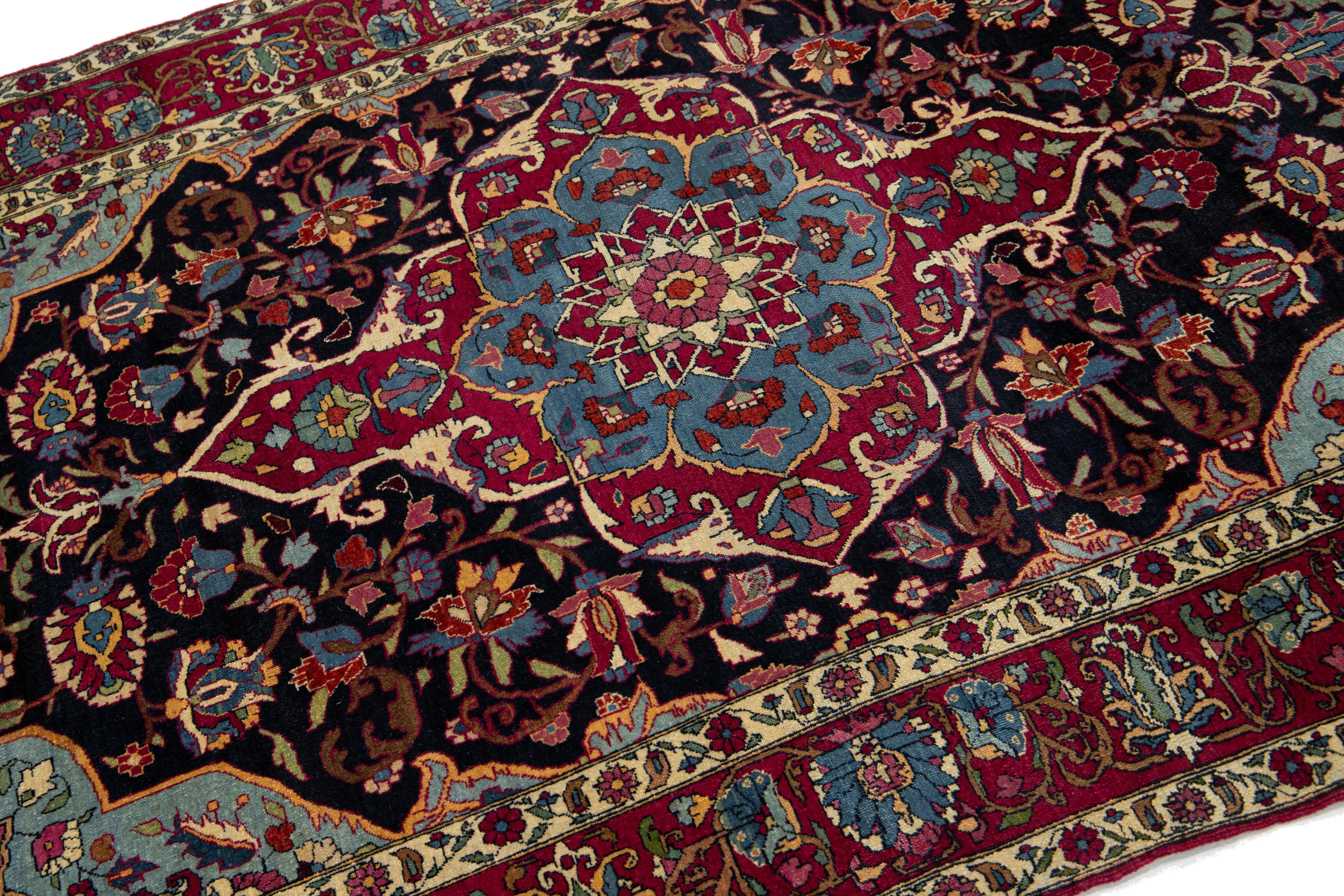 Hand-Knotted Antique Kerman Persian Dark Blue Wool Rug with a Medallion Floral Design For Sale