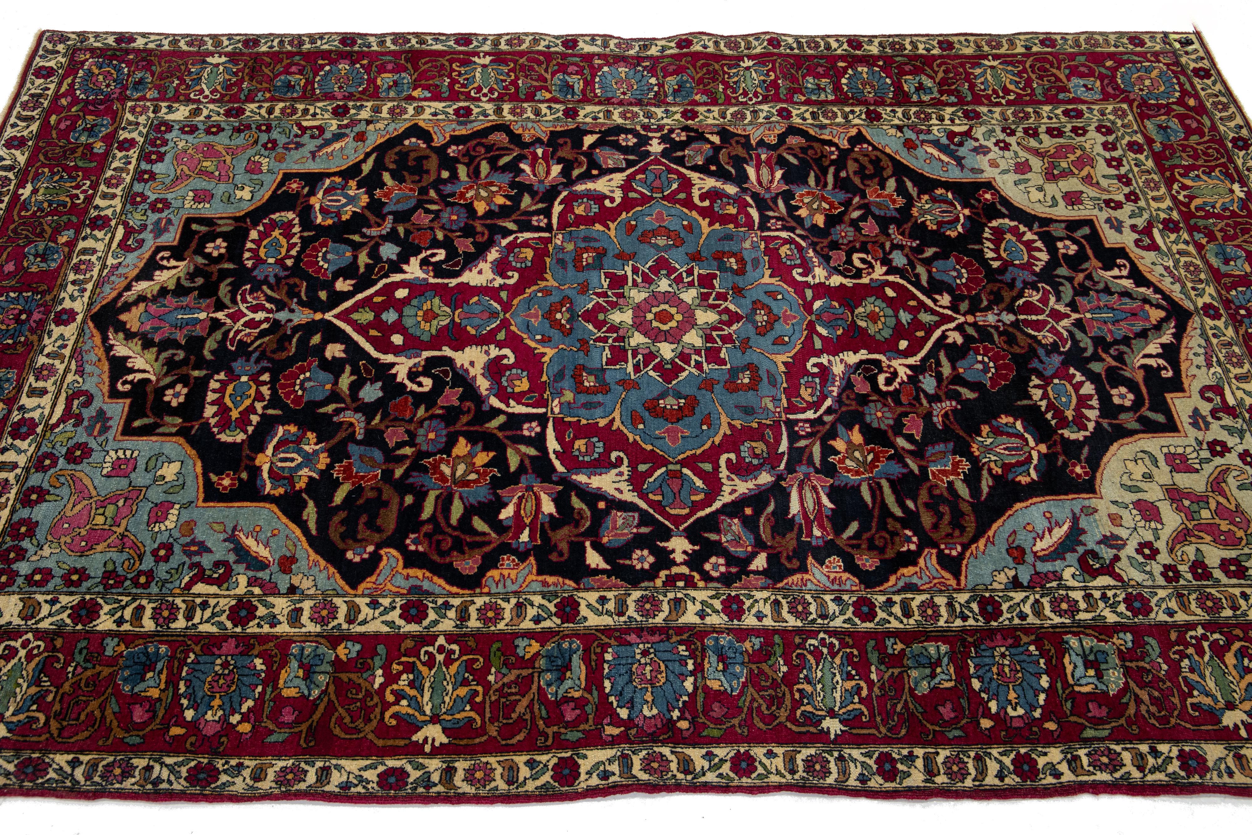 Antique Kerman Persian Dark Blue Wool Rug with a Medallion Floral Design In Good Condition For Sale In Norwalk, CT