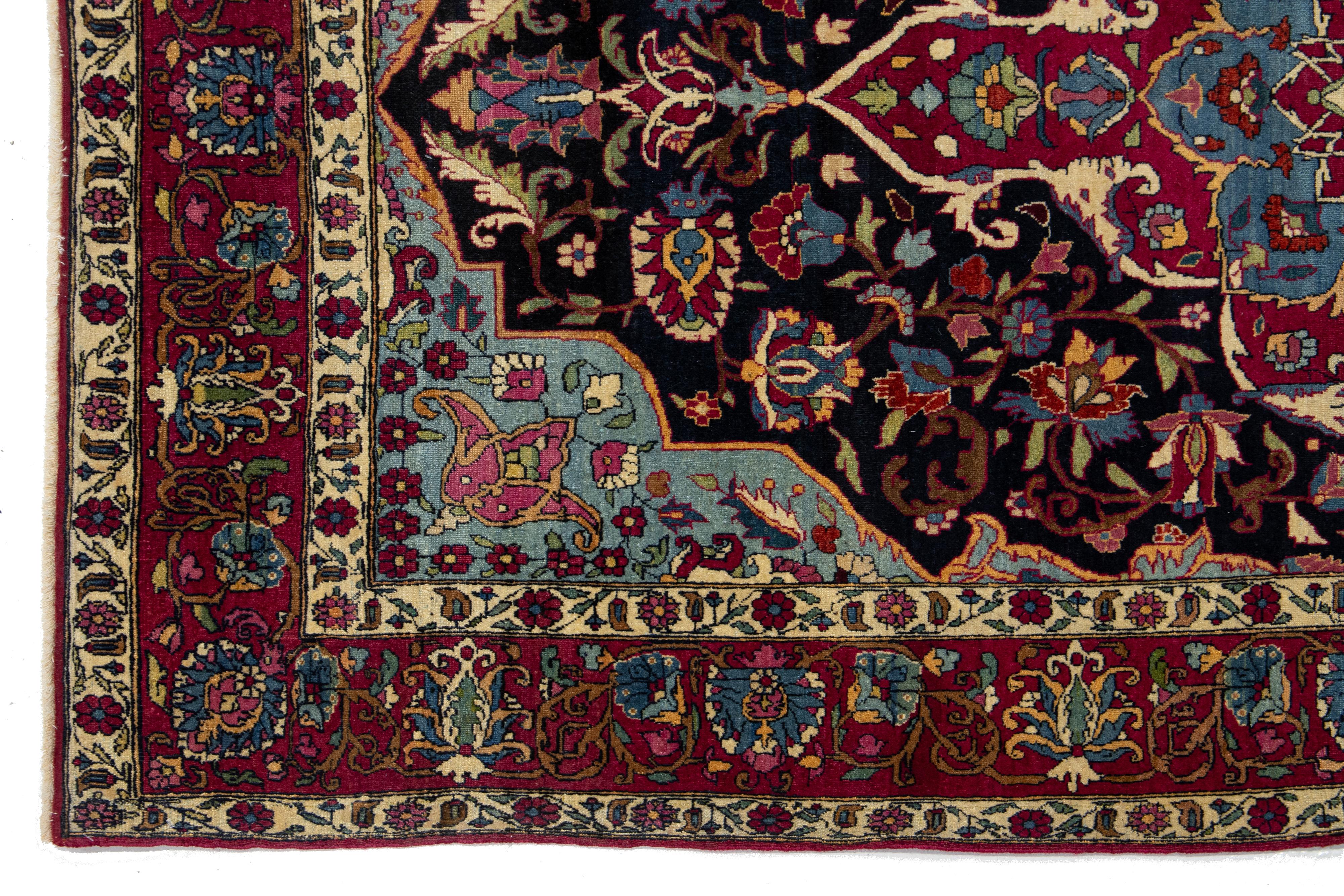 20th Century Antique Kerman Persian Dark Blue Wool Rug with a Medallion Floral Design For Sale