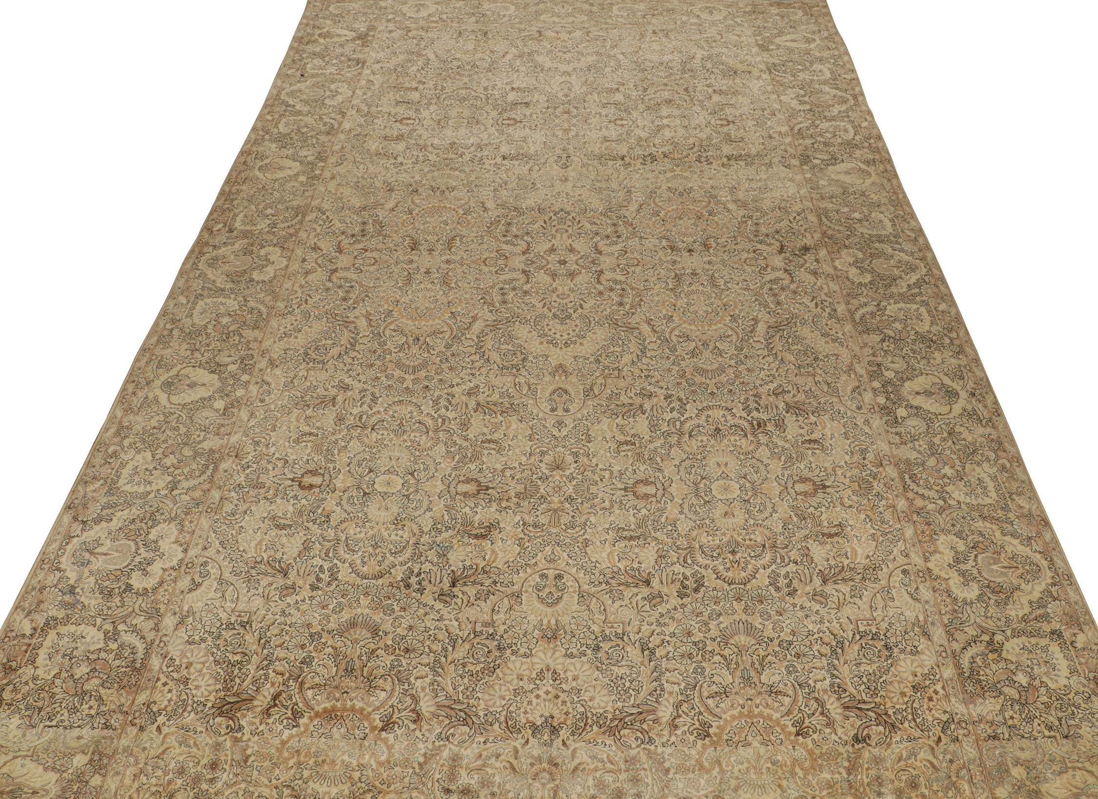 An antique 12x21 Persian Kerman rug, hand-knotted in wool circa 1920s.

Further On the Design:

This antique piece is a royal selection that enjoys patterns in beige and gold, deliciously punctuated by ice blue and black details. Keen eyes will