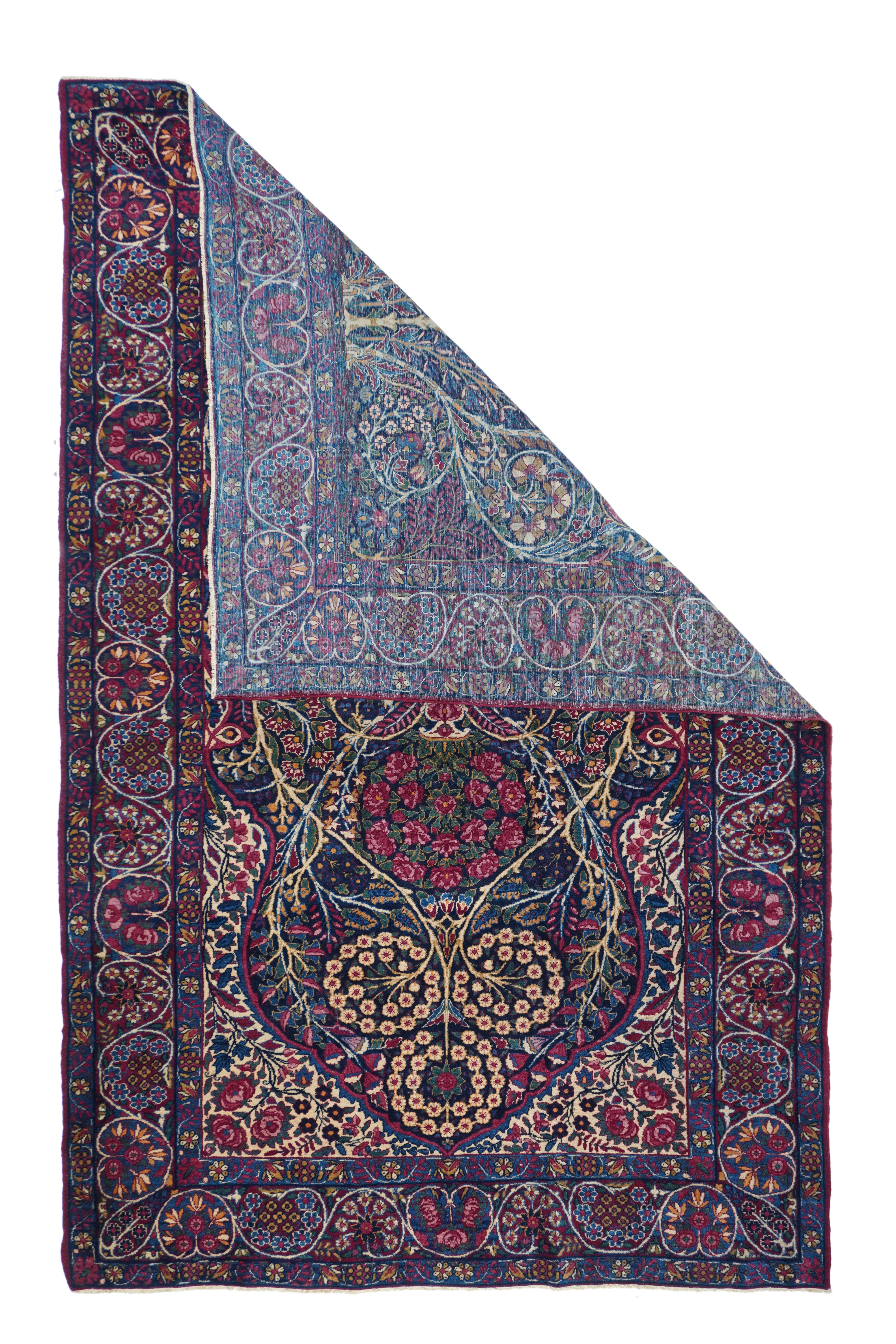 Antique Kerman Rug 5'7'' x 8'7''. This niche layout SE Persian urban scatter shows a slender tree, bifurcating and rejoining, with accents of double floret wreaths at the apex and millefleurs-style vinery and volutes throughout. Navy field with