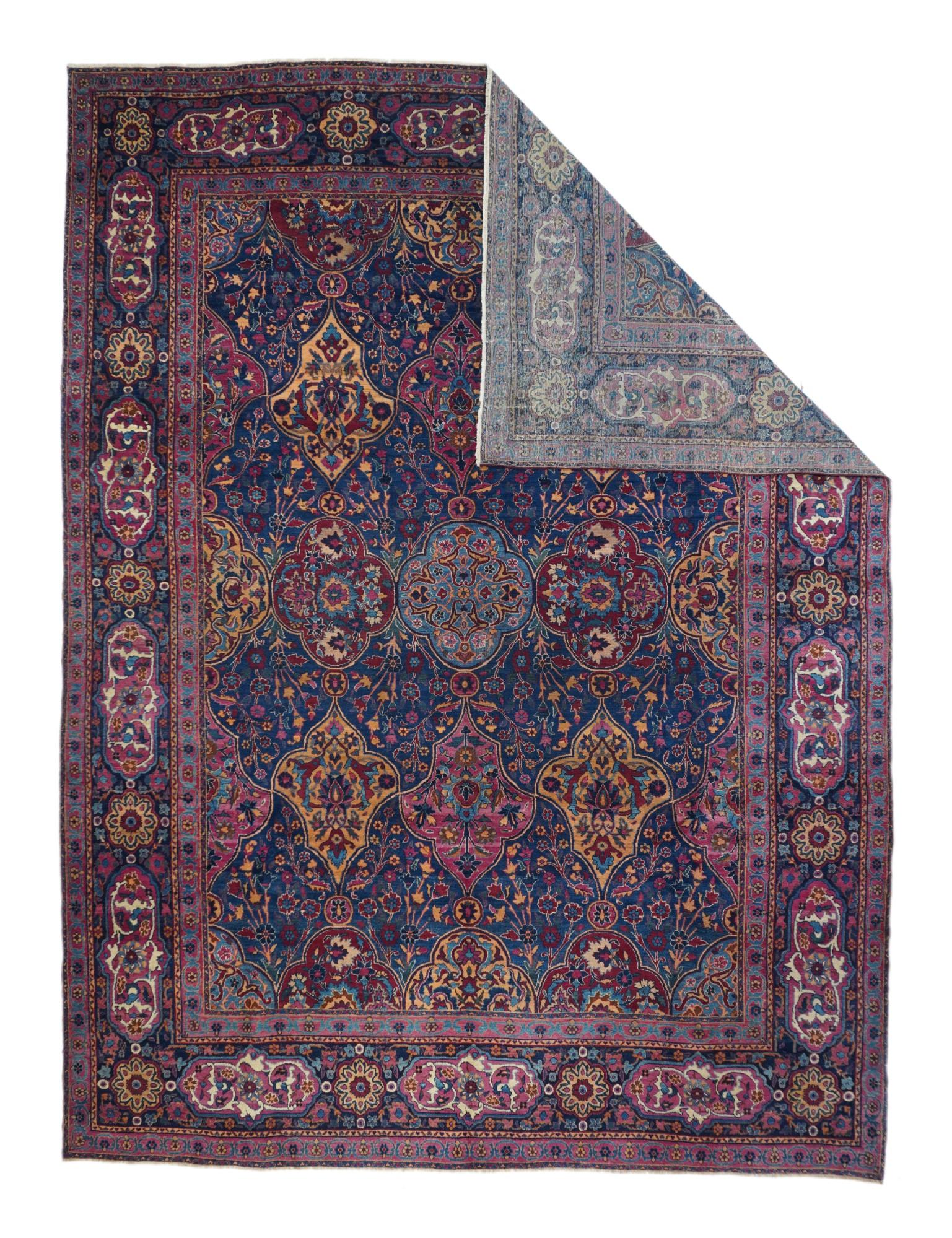This 1920’s SE Persian city carpet shows a royal blue field patterned by quadrilobes and shield cartouches in light blue, straw, teal and wine red. A variety of flowering stems fills in the reserves while palmettes accent the major panels. Navy main
