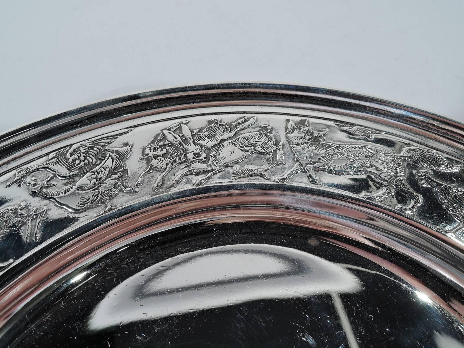 Edwardian sterling silver plate with Noah’s Ark theme. Made by William B. Kerr in Newark. Well plain. On shoulder are the animals – pigs, goats, bunnies, geese, and so on. A dense and lively frieze – less an orderly two-by-two procession than a
