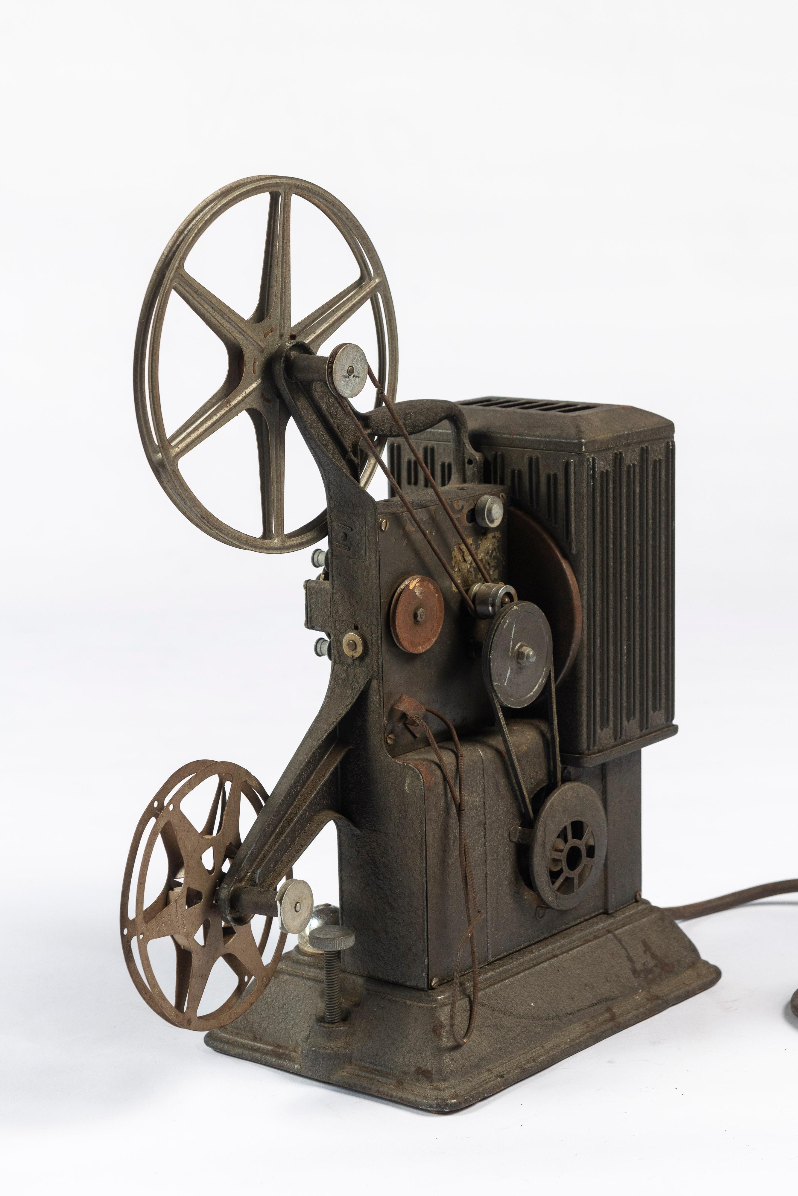 This antique Keystone 8 M.M. Film Projector, Model R-8, S/N 444000, was manufactured in Boston, MA, USA. Keystone was an iconic American brand, well known for creating equipment for the making and showing of home movies. This projector does not have