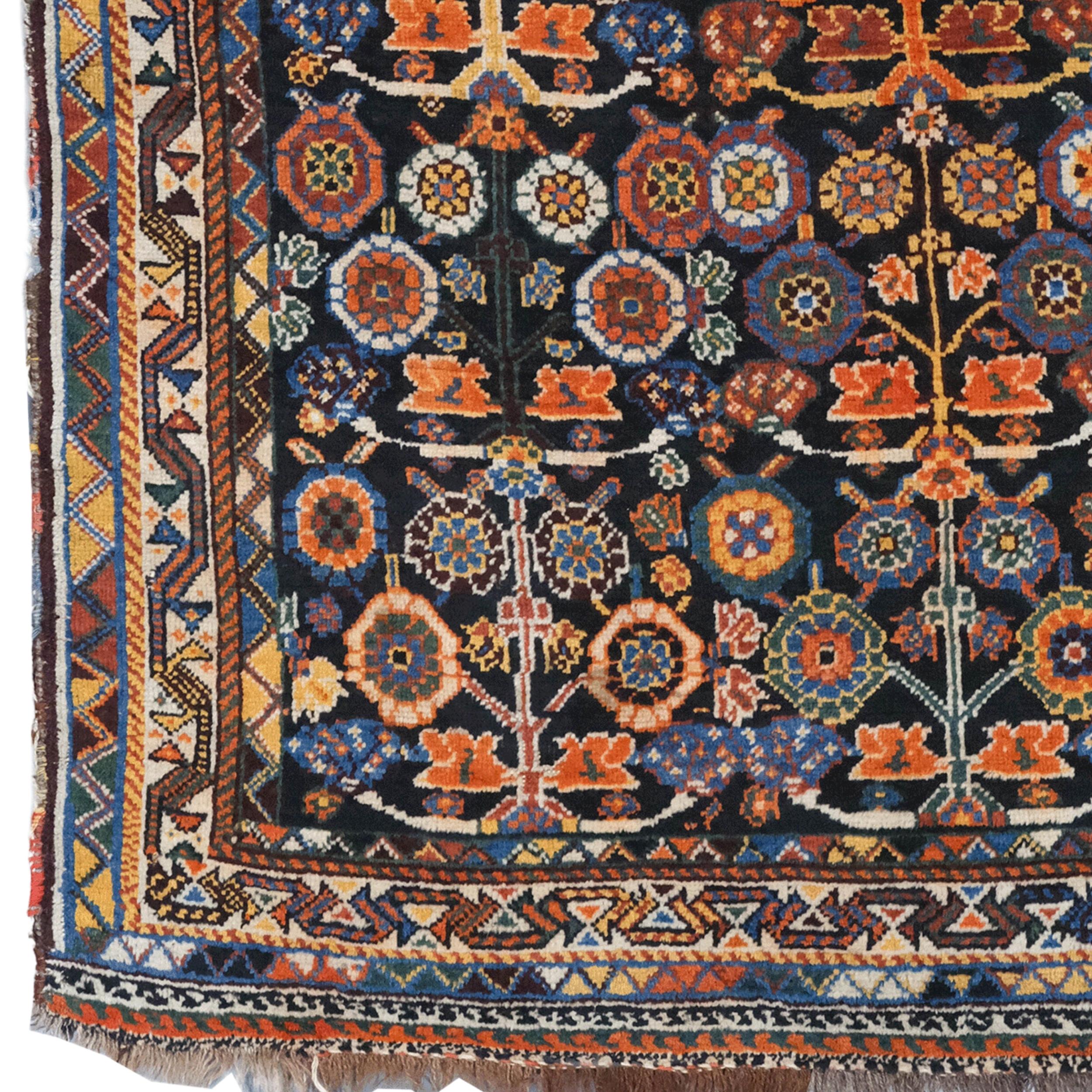 Late 19th Century Persian Khamseh Rug

This antique rug is a rare Khamseh rug from the late 19th century. Khamseh carpets were woven by nomadic tribes of the Khamseh confederation living in Southern Iran. This carpet attracts attention with its rich