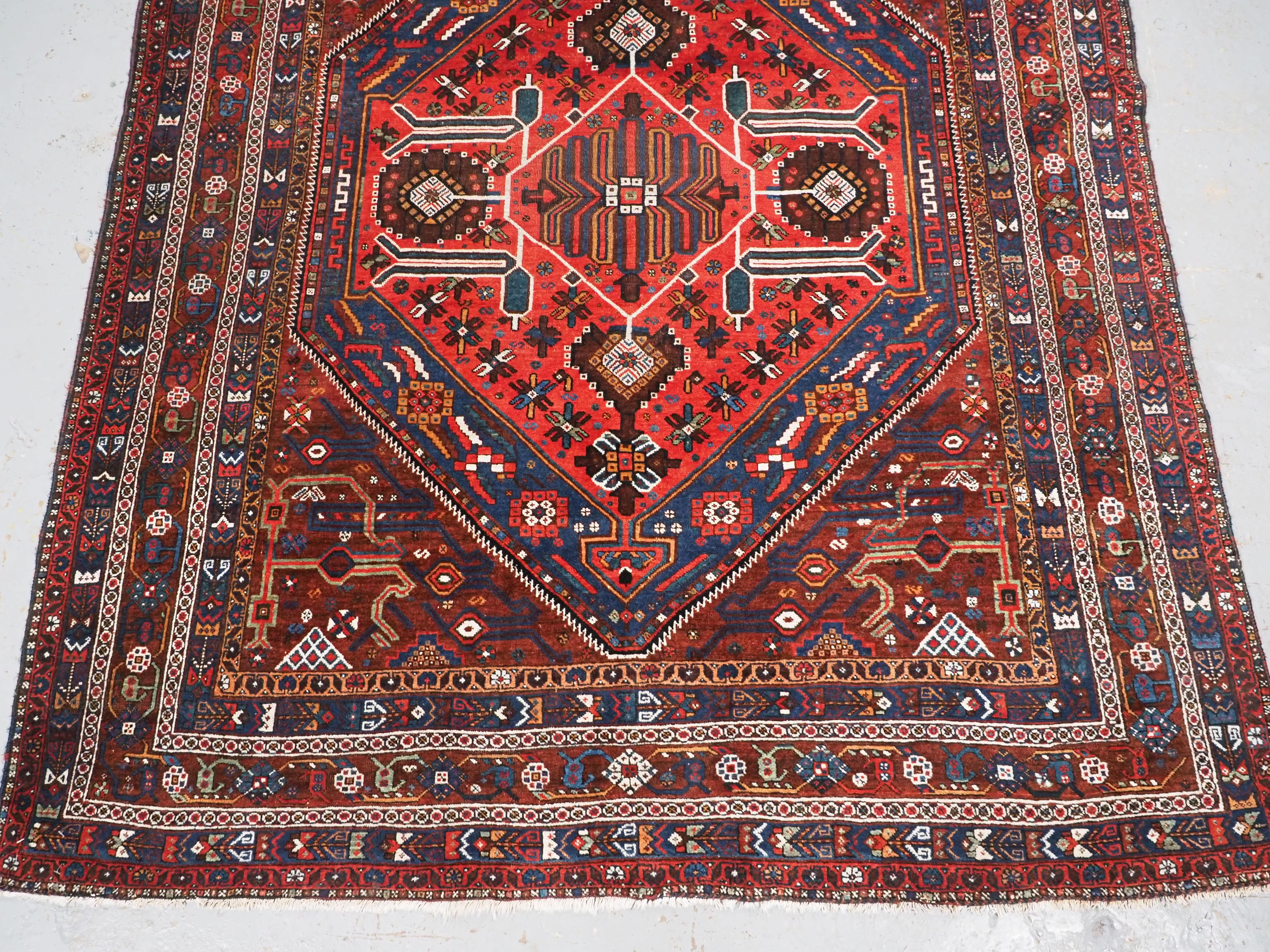 Early 20th Century Antique  Khamseh Rug with large medallion design.  Circa 1900. For Sale