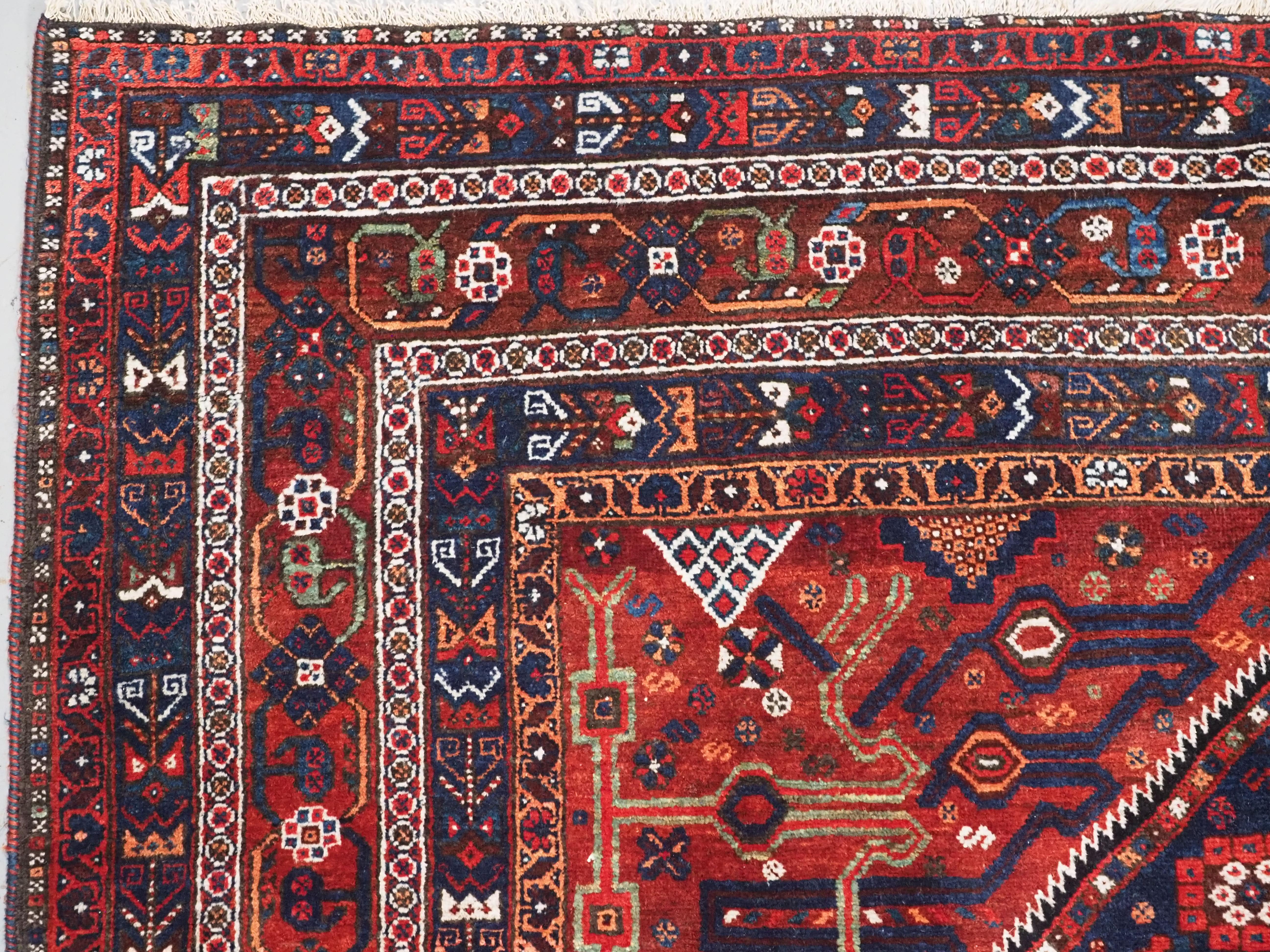 Wool Antique  Khamseh Rug with large medallion design.  Circa 1900. For Sale