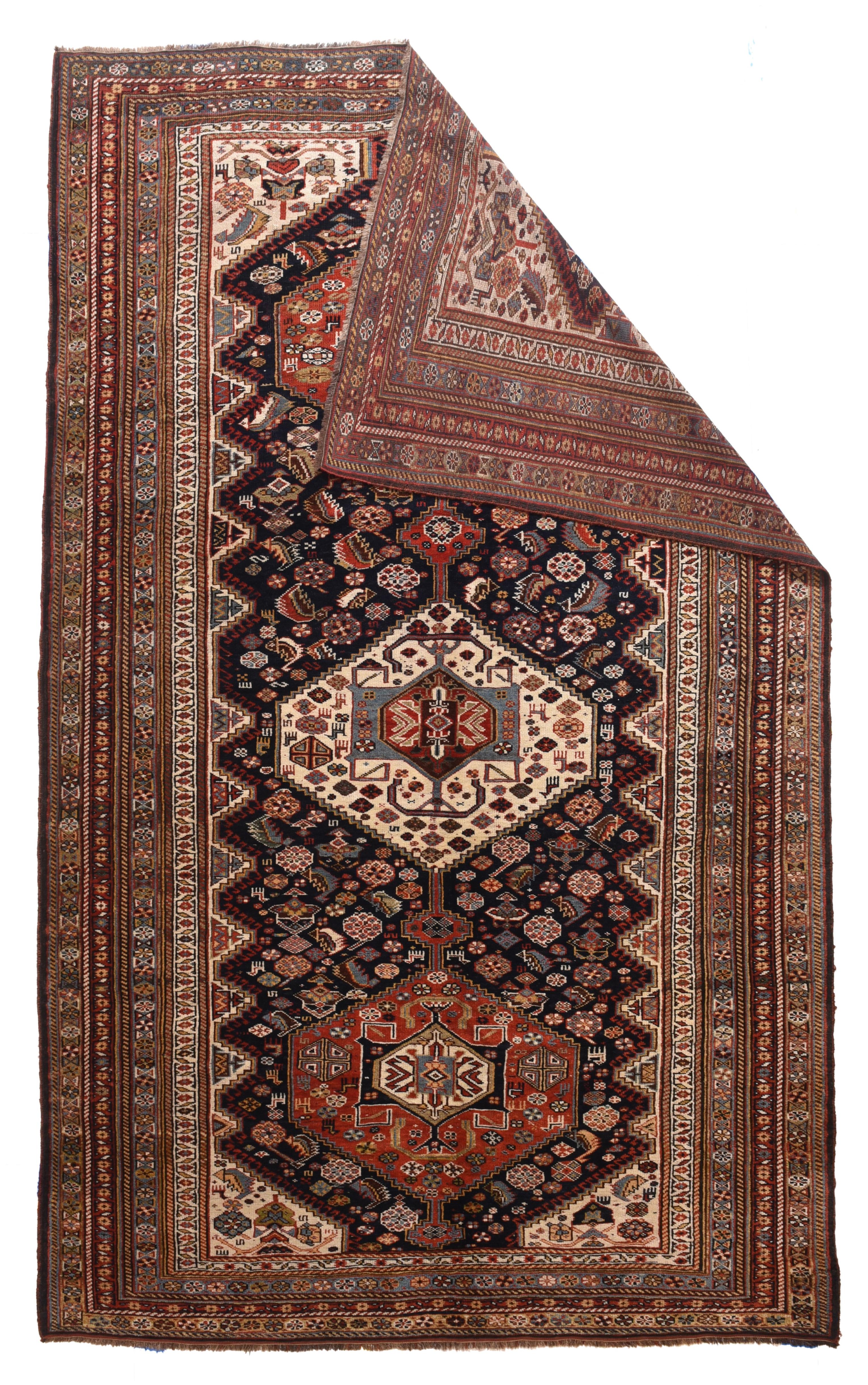 Antique Khamseh Tribal rug measures 5'8'' x 9'3''.