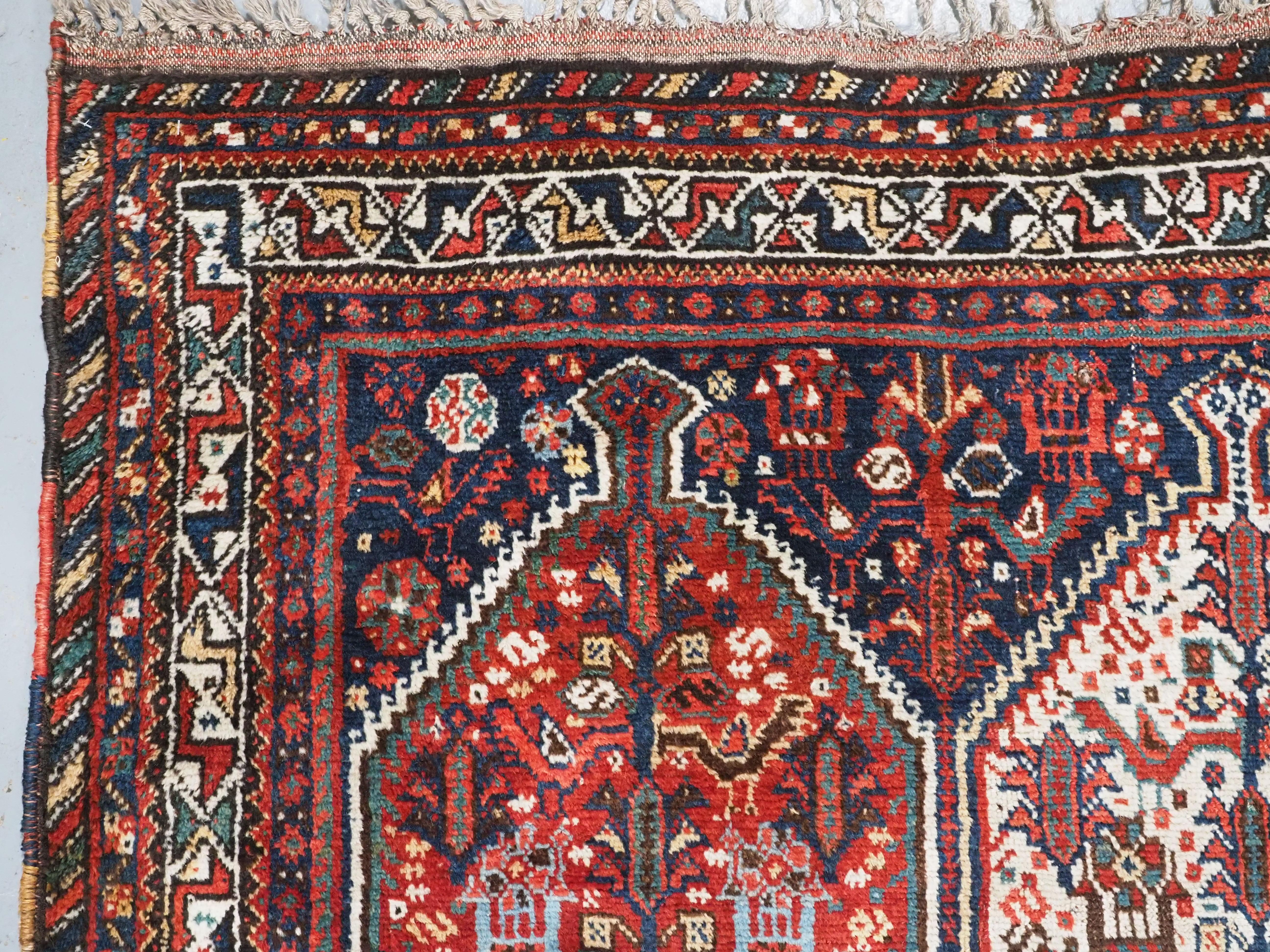 Wool Antique  Khamseh tribal rug of bird medallion design.  Circa 1900. For Sale