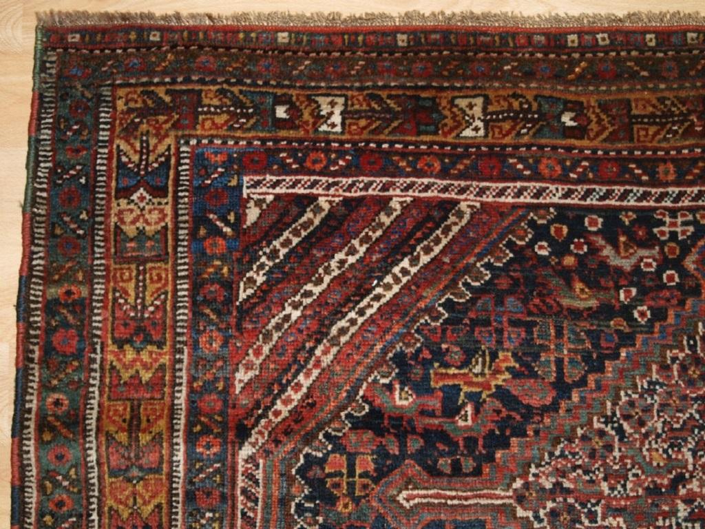 Antique South West Persian Khamseh Rug with three linked medallions
Circa 1890

A tribal rug of the classic bird design with the medallions and field covered with pecking chickens The rug has a classic Khamseh border on a rich gold ground

Excellent