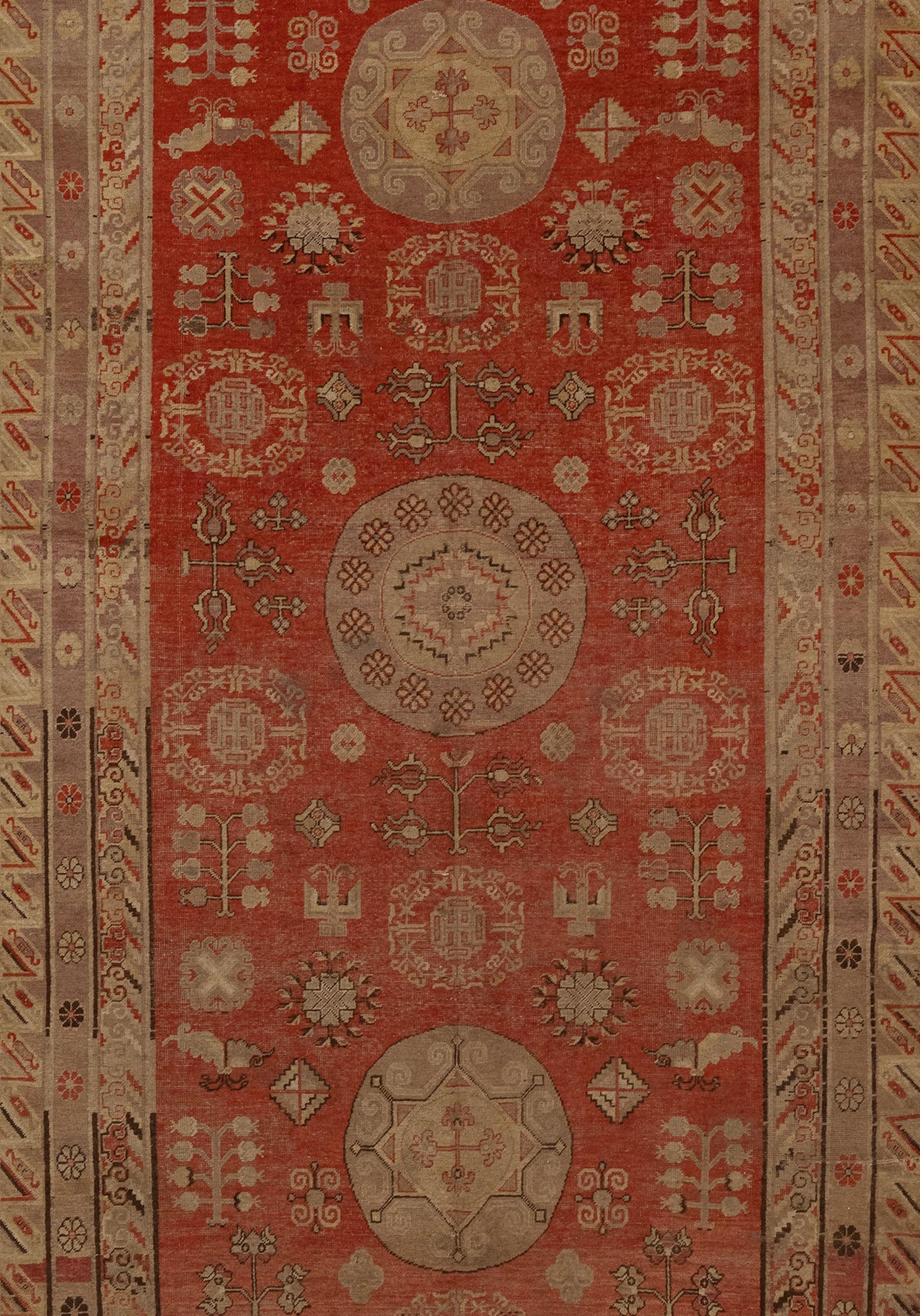 Antique Khotan area rug in soft colors circa 1880's in good condition.
