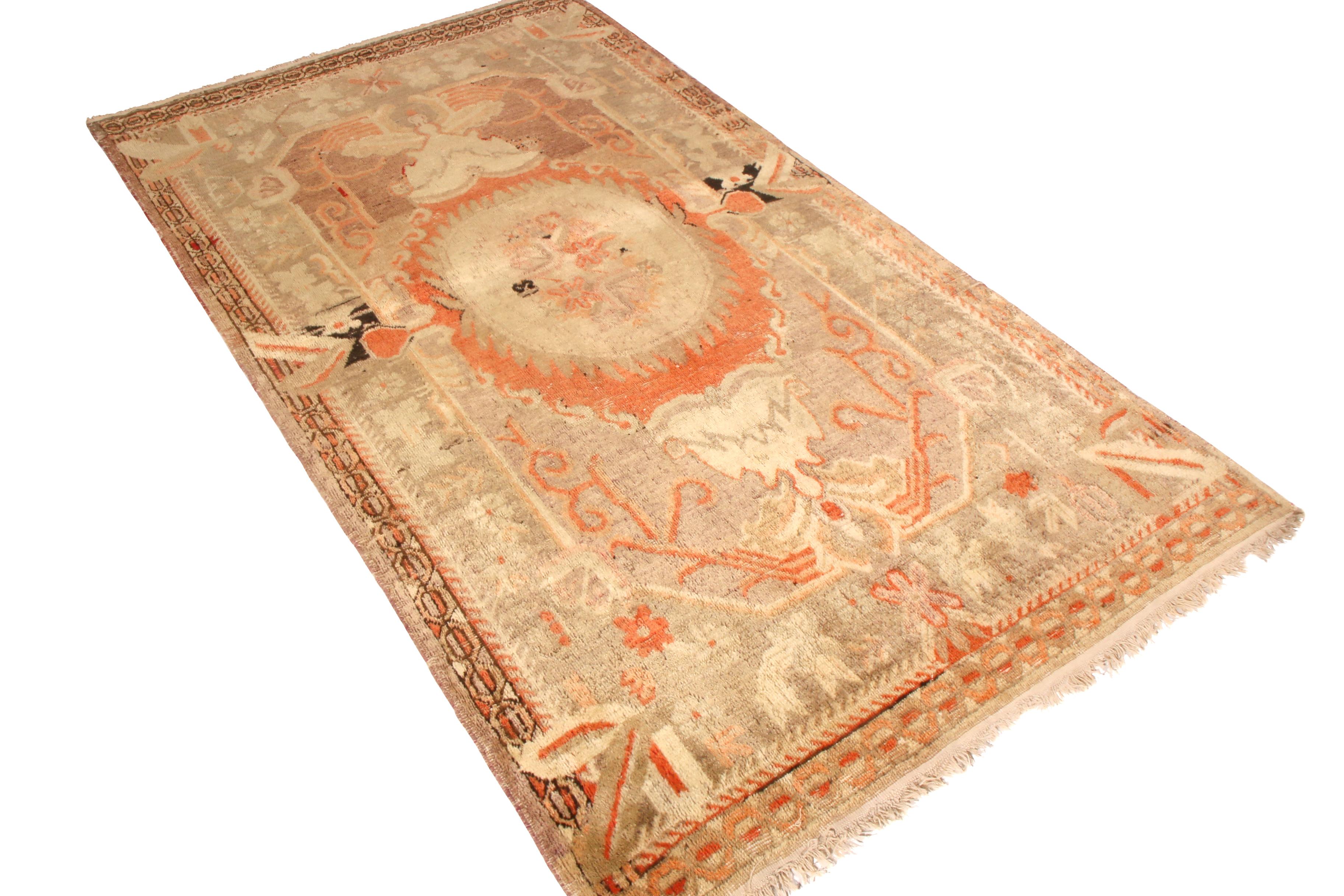 Made with hand knotted wool originating from East Turkestan between 1880-1890, this antique Khotan rug bears a remarkably unique traditional European sensibility in the nature of its medallion style pattern and complementary floral ornaments.