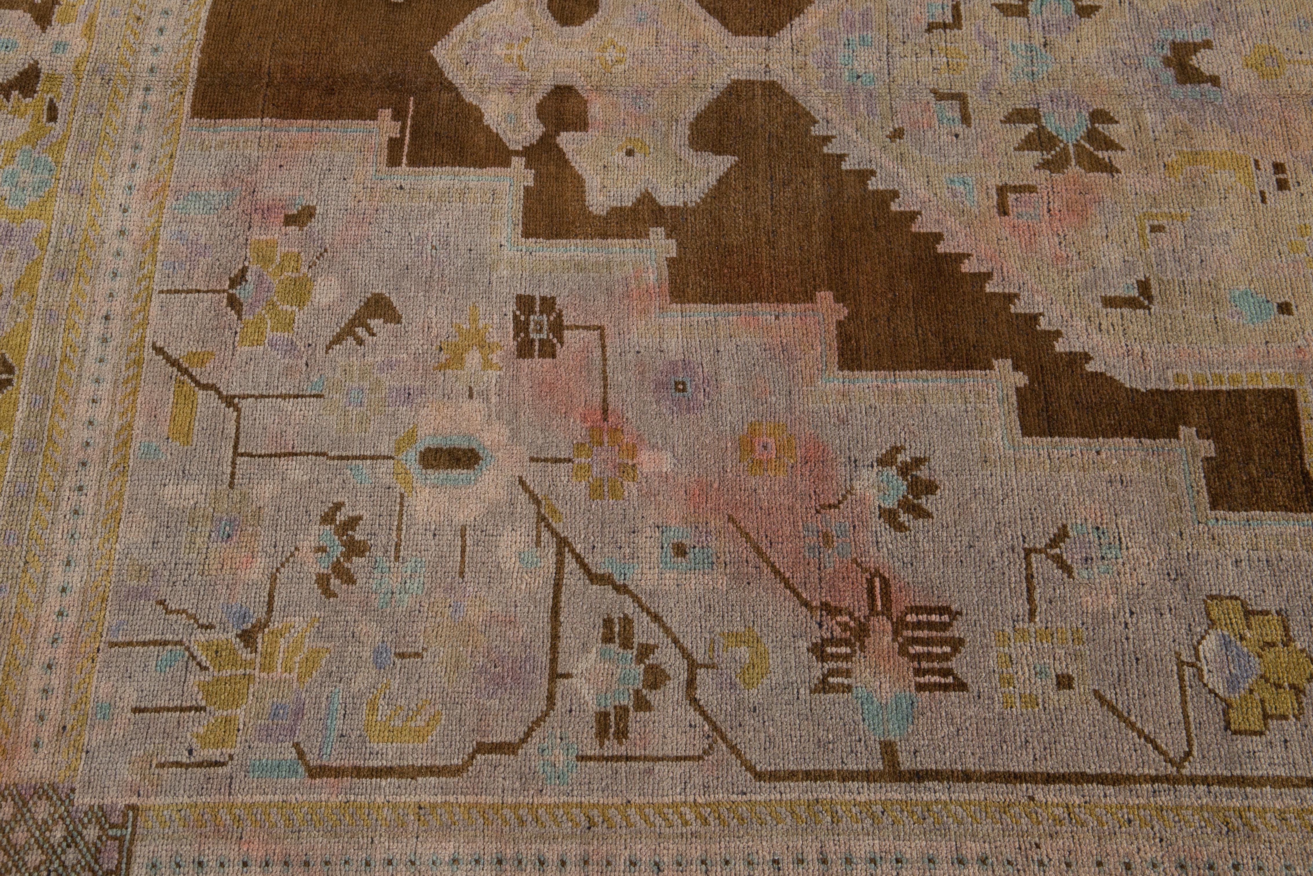 Hand-Knotted Antique Khotan Handmade Medallion Floral Motif Tan Room Size Wool Rug For Sale