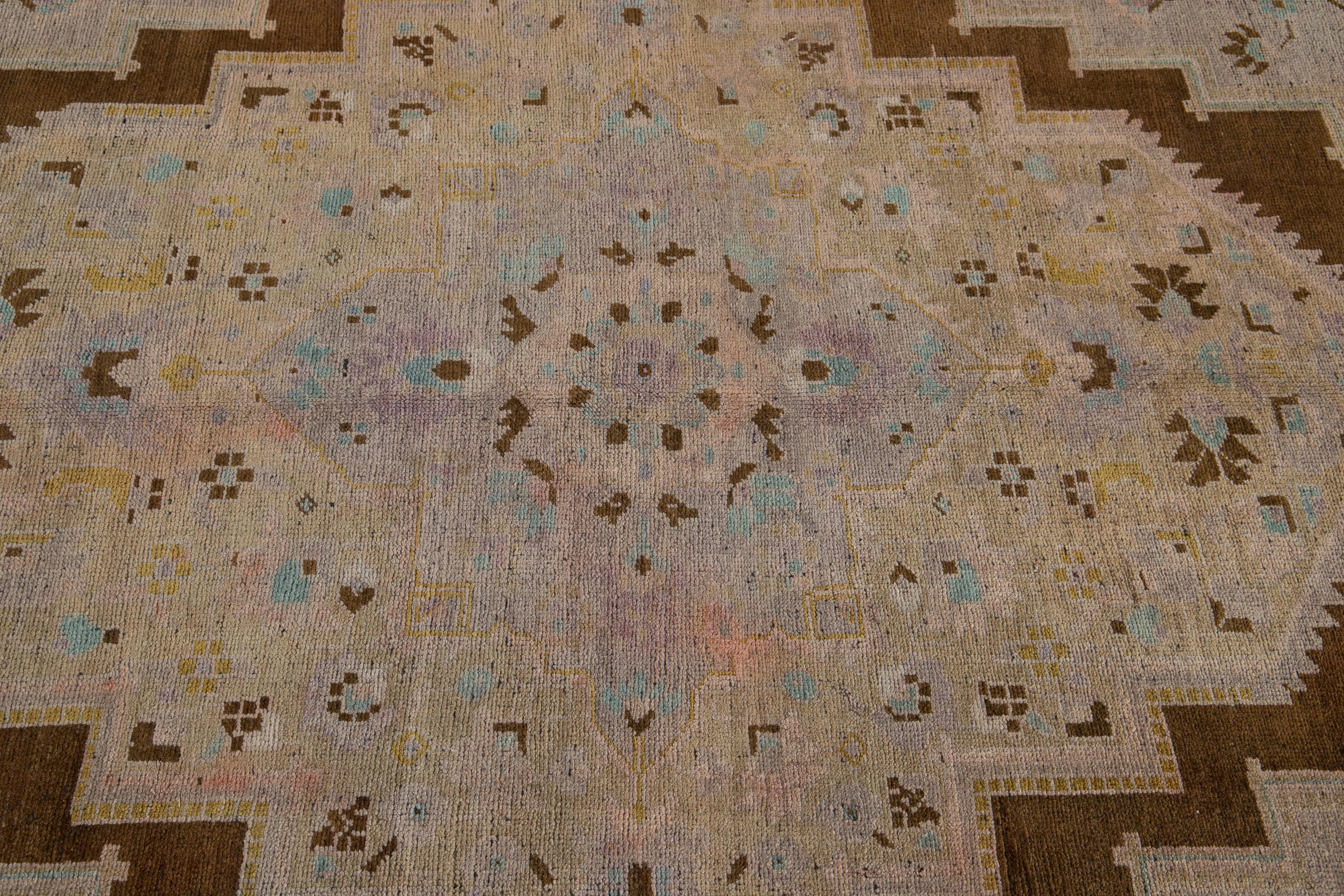 20th Century Antique Khotan Handmade Medallion Floral Motif Tan Room Size Wool Rug For Sale