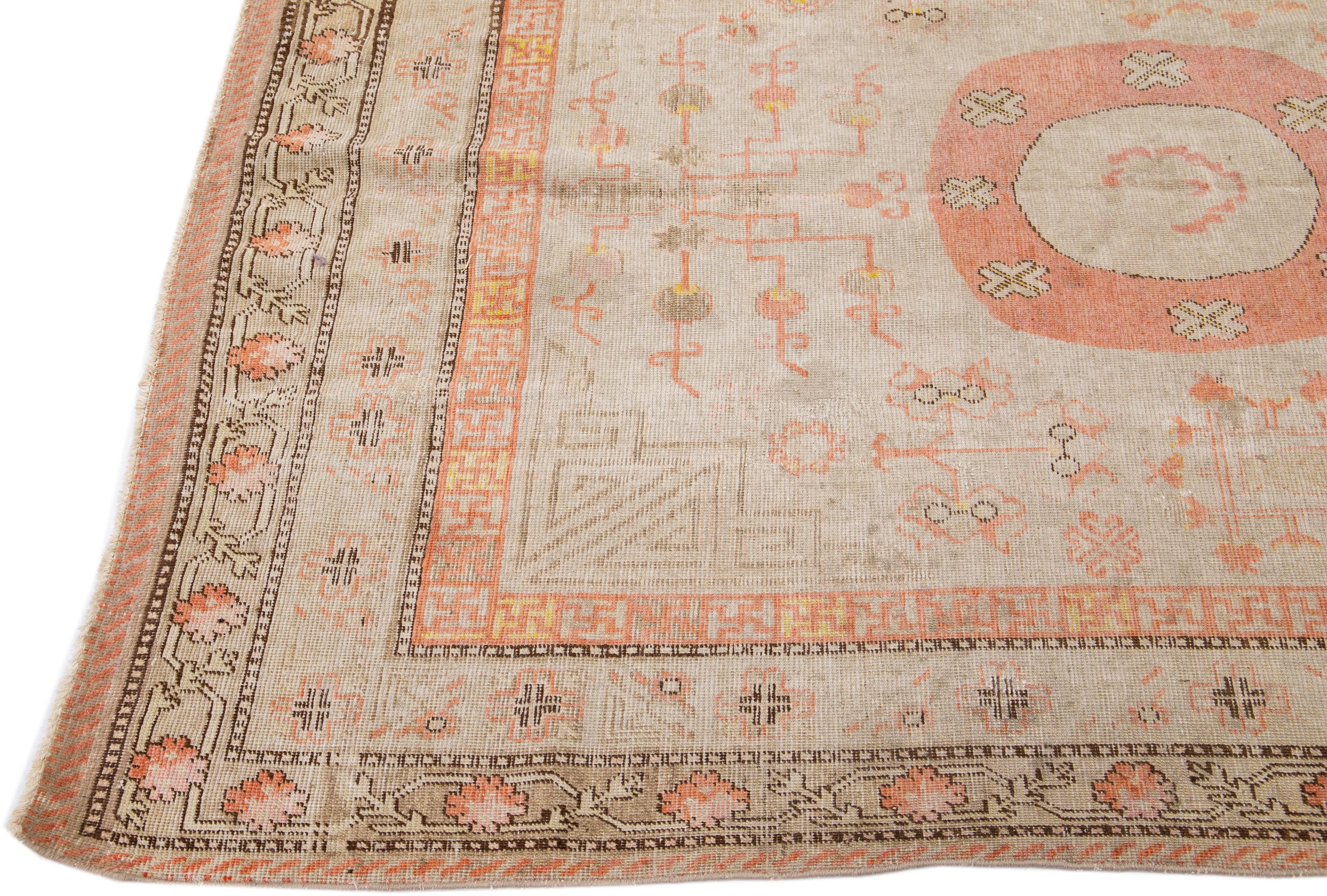 Hand-Knotted Antique Khotan Handmade Peach Persian Wool Rug With Allover Design For Sale