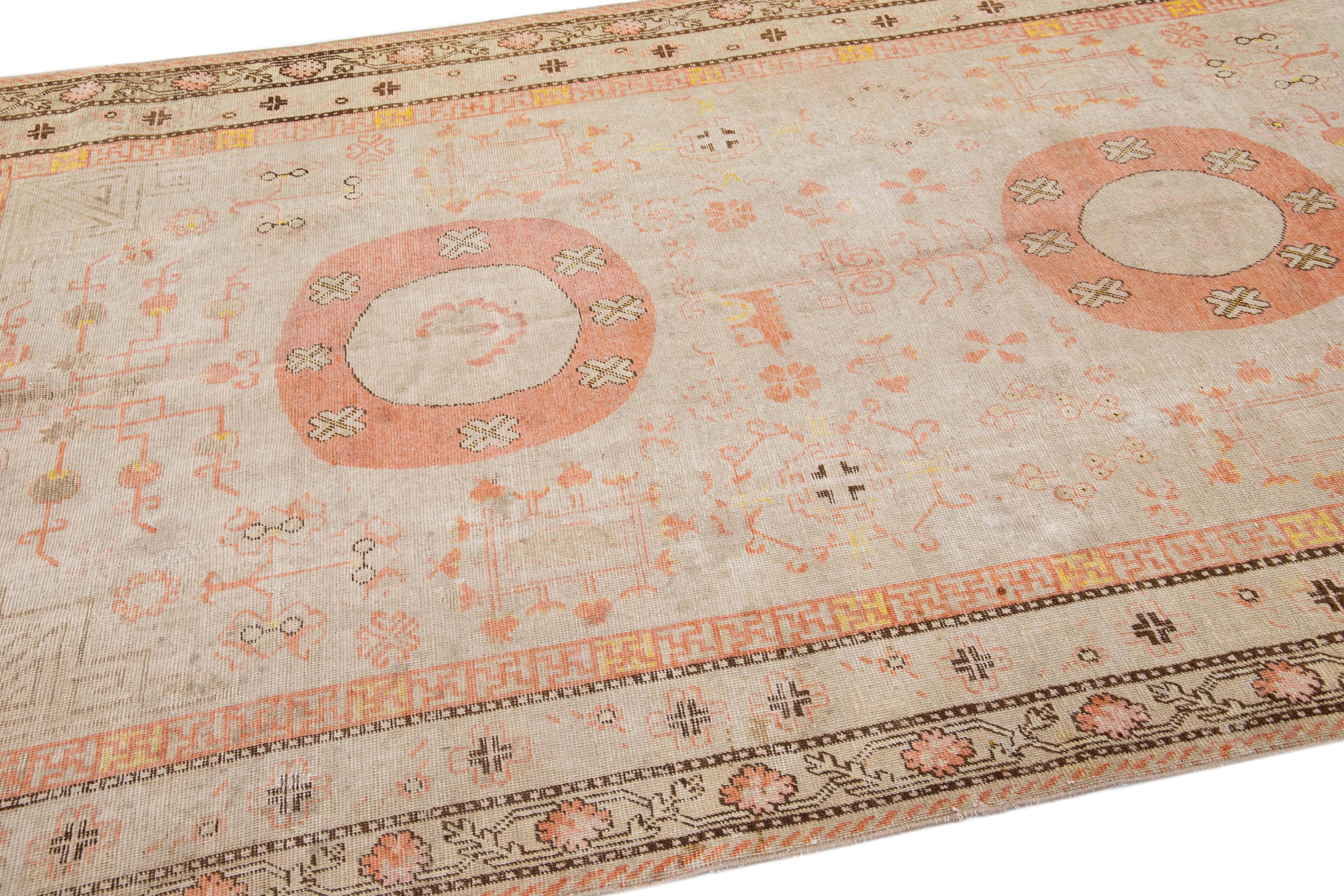 20th Century Antique Khotan Handmade Peach Persian Wool Rug With Allover Design For Sale