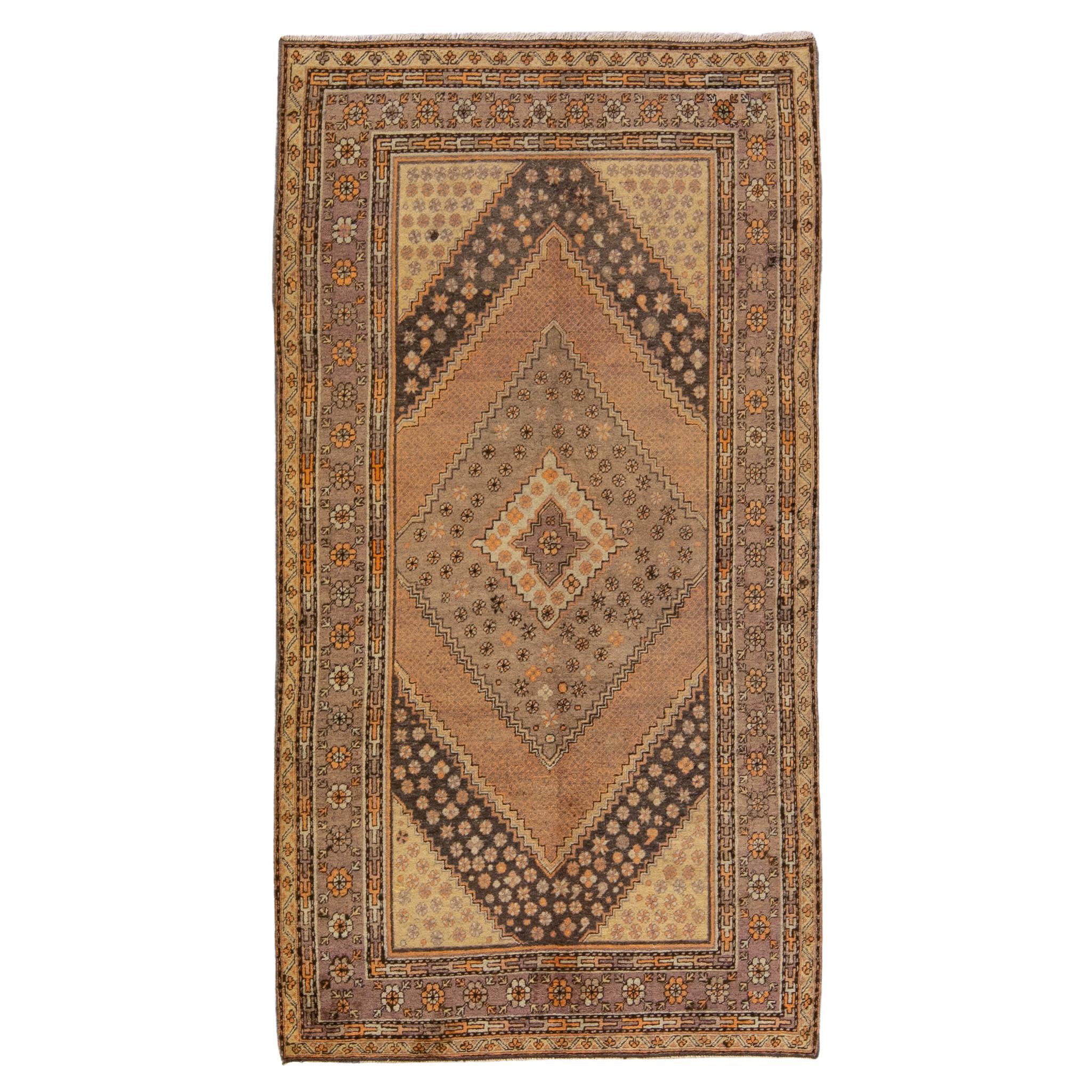 Ancien tapis Khotan en laine médaillon brun clair fait à la main