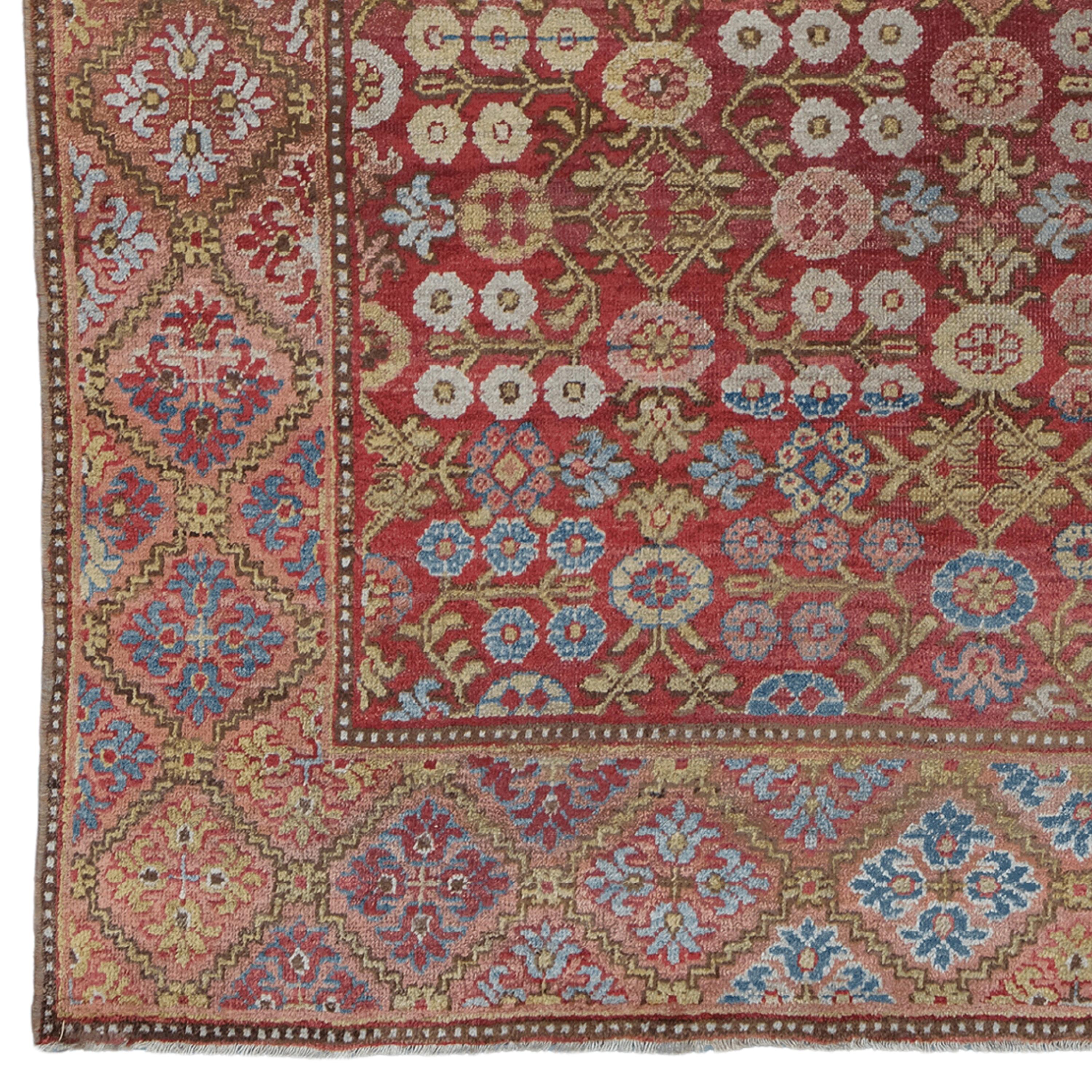 This exquisite antique Khotan rug is a work of art from the late 19th century. This piece, which draws attention with its rich color palette and complex patterns, has a feature that will enrich the atmosphere of any space. Wool material is known for