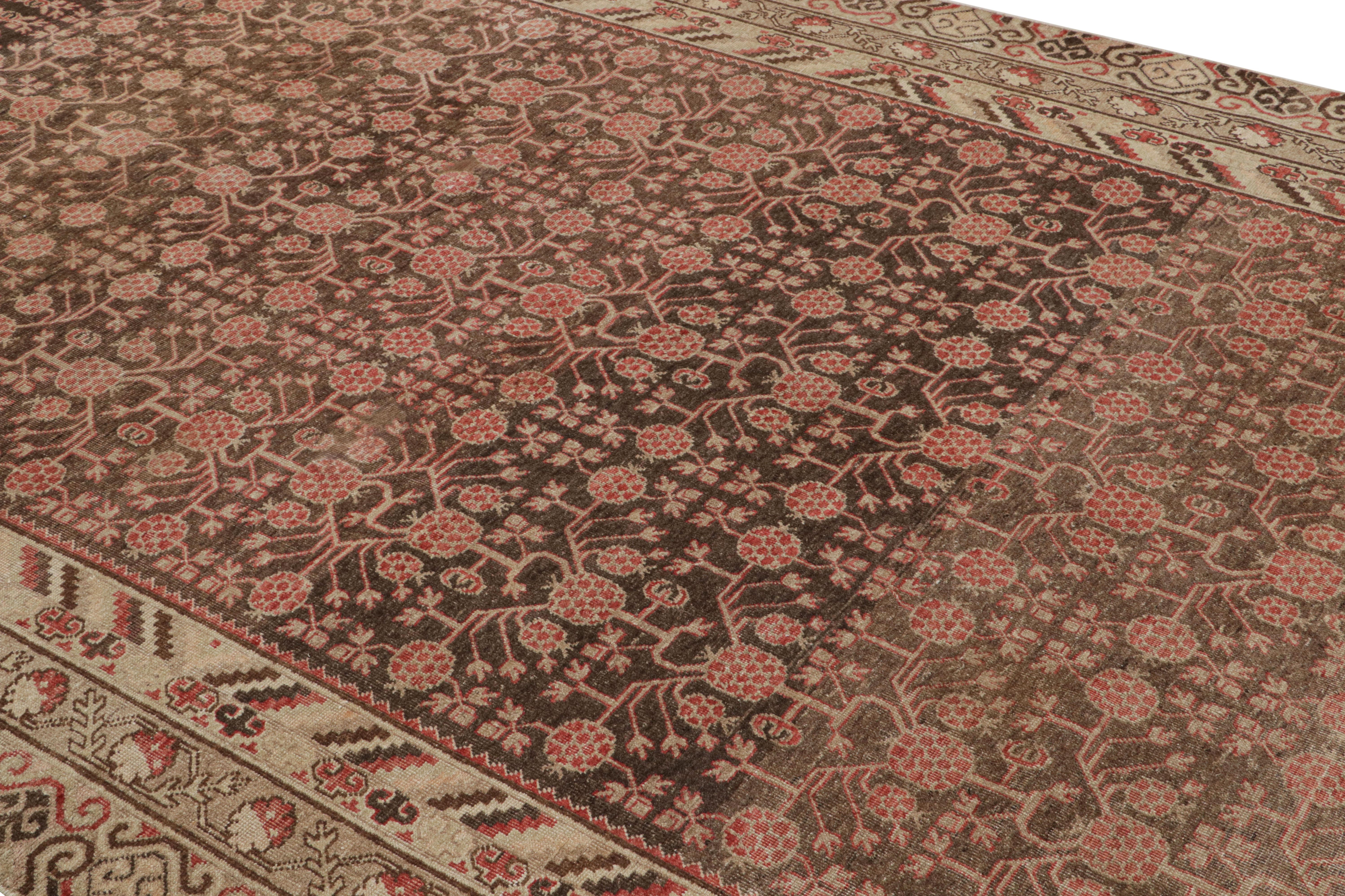 Hand knotted in wool originating from East Turkestan circa 1890-1900, this antique rug connotes a Classic Khotan rug design with a Classic approach to transitional colorway celebrated in this oriental rug family. Further enjoying the Classic