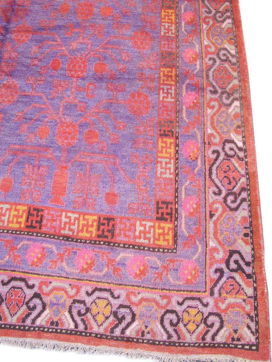 Antique Khotan Rug, Early 20th Century

Woven in an oasis town of the Tarim Basin in Xinjiang, a Turkic-speaking autonomous region in the far west of China, this piece is remarkably faithful to the drawing of much earlier Khotan carpets. The central