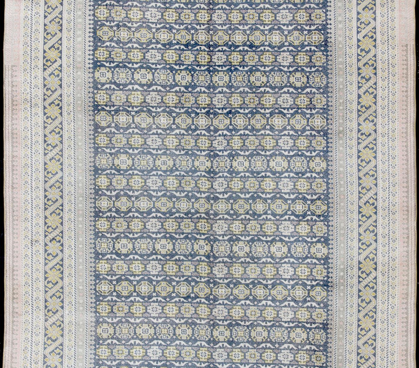Antique Khotan rug in shades of blue, Taupe, gray, pink, and yellow, rug SUS-2009-75, country of origin / type: Turkestan / Khotan, 1930

This attractive Khotan rug is a spectacular testament to the complexity of Turkestan design. The dark