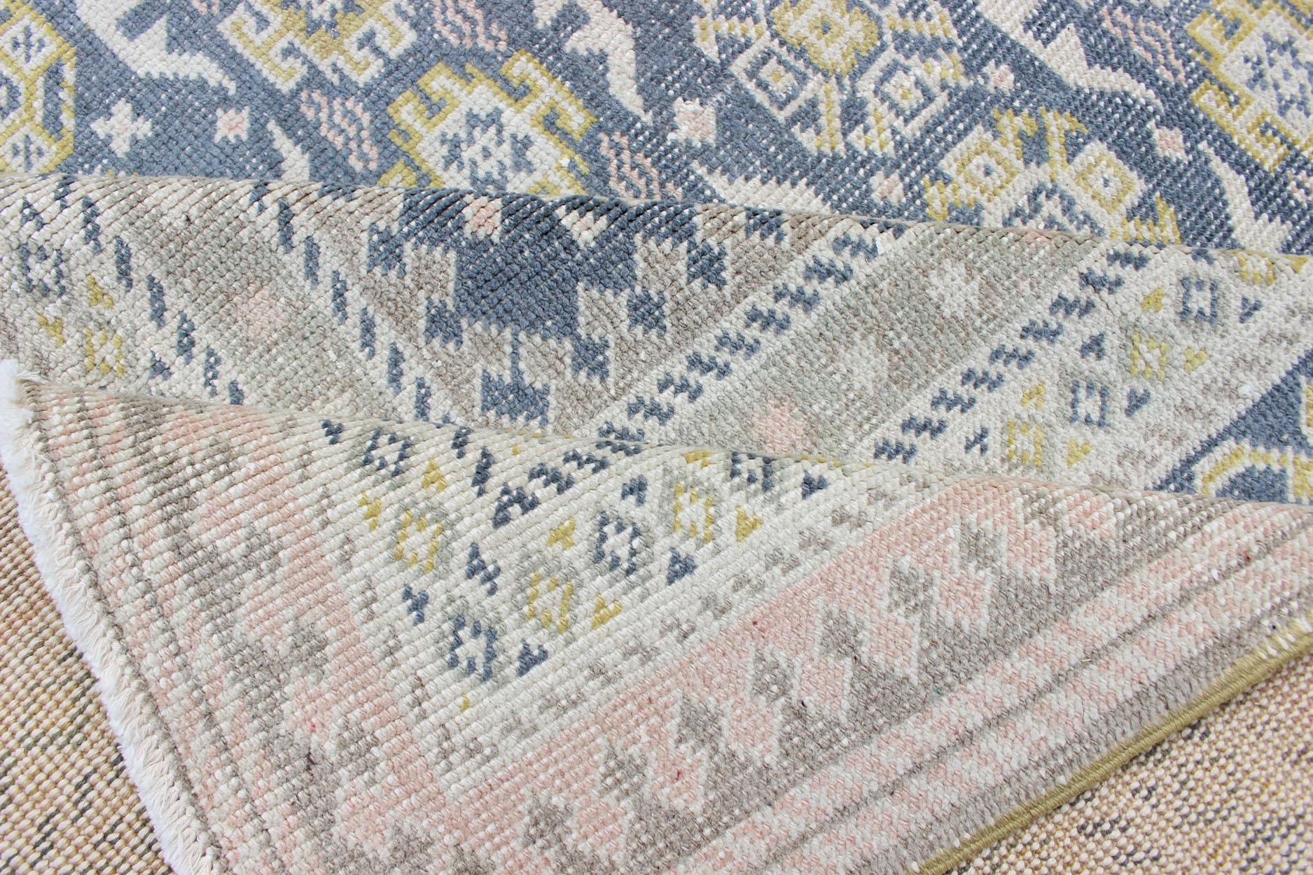 Hand-Knotted Antique Khotan Rug in Shades of Blue with Gray, L. Pink and Yellow Accents For Sale