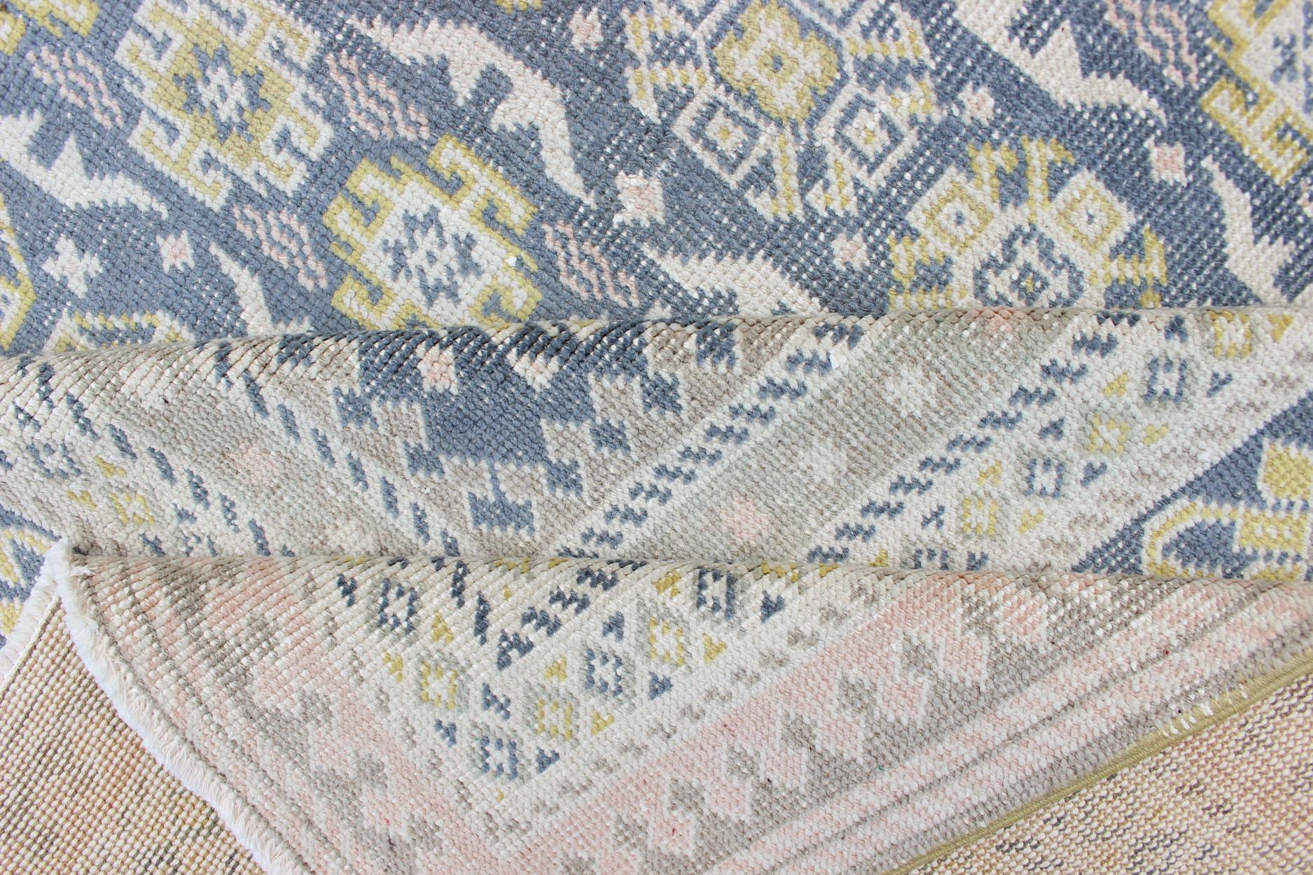 Antique Khotan Rug in Shades of Blue with Gray, L. Pink and Yellow Accents In Good Condition For Sale In Atlanta, GA