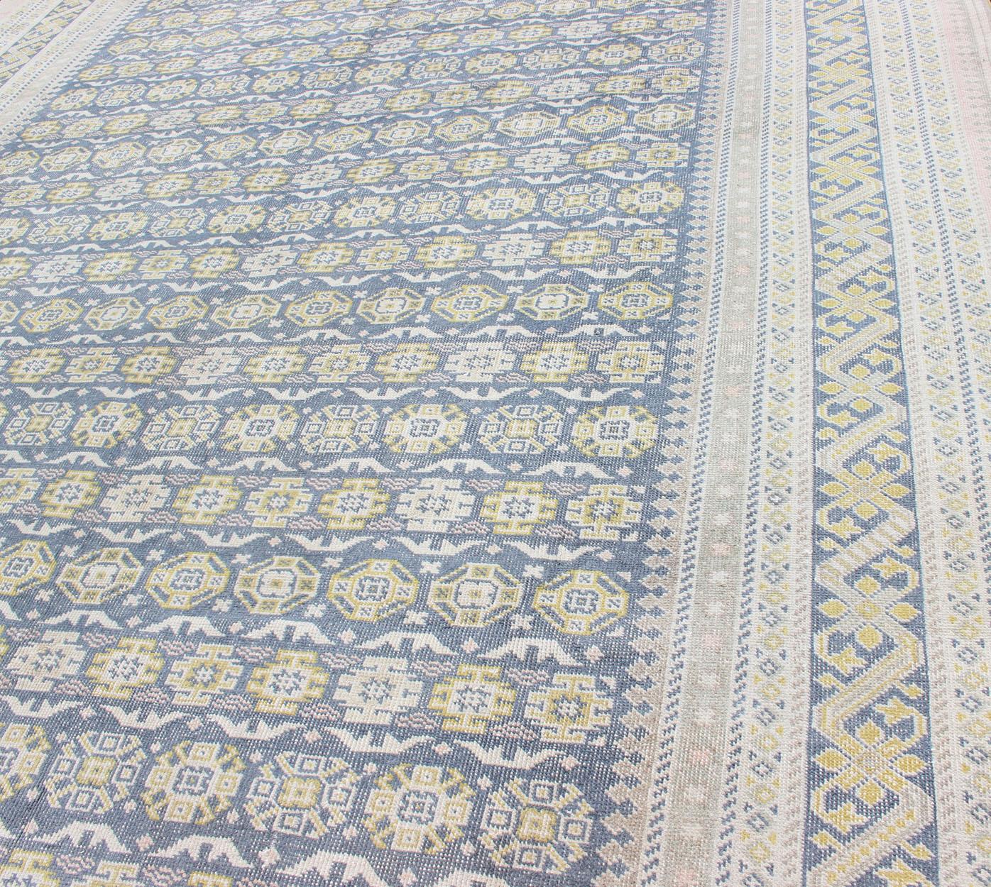 20th Century Antique Khotan Rug in Shades of Blue with Gray, L. Pink and Yellow Accents For Sale