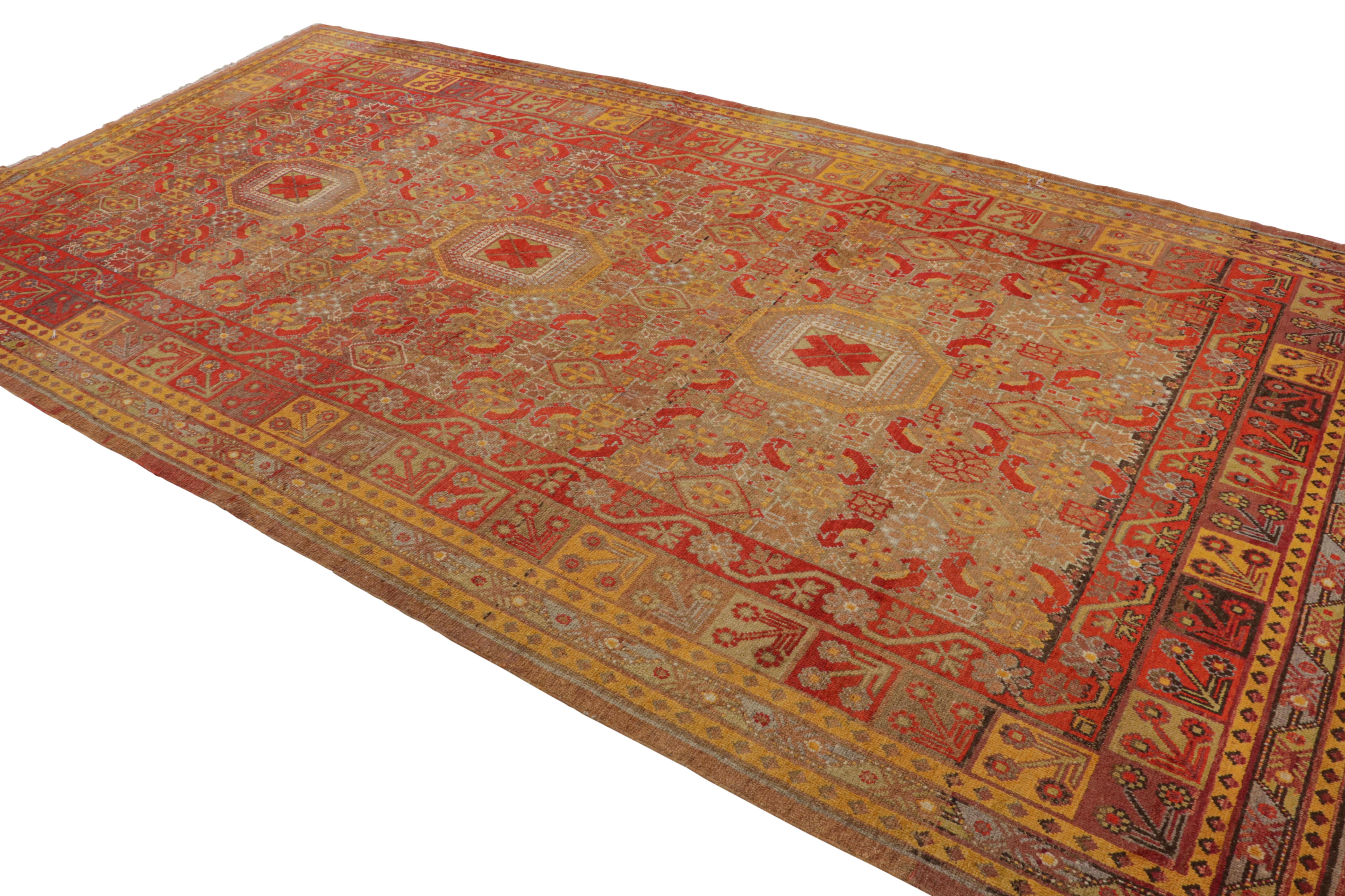 Hand-Knotted Antique Khotan Rug Medallion Style Red Blue and Gold Pattern by Rug & Kilim For Sale