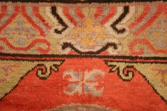 Antique Khotan Rug with Moon Shaped Roundels