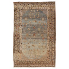 Antique Khotan Rug With Soft Blue Field and Symbolic Motif Design in Tan's