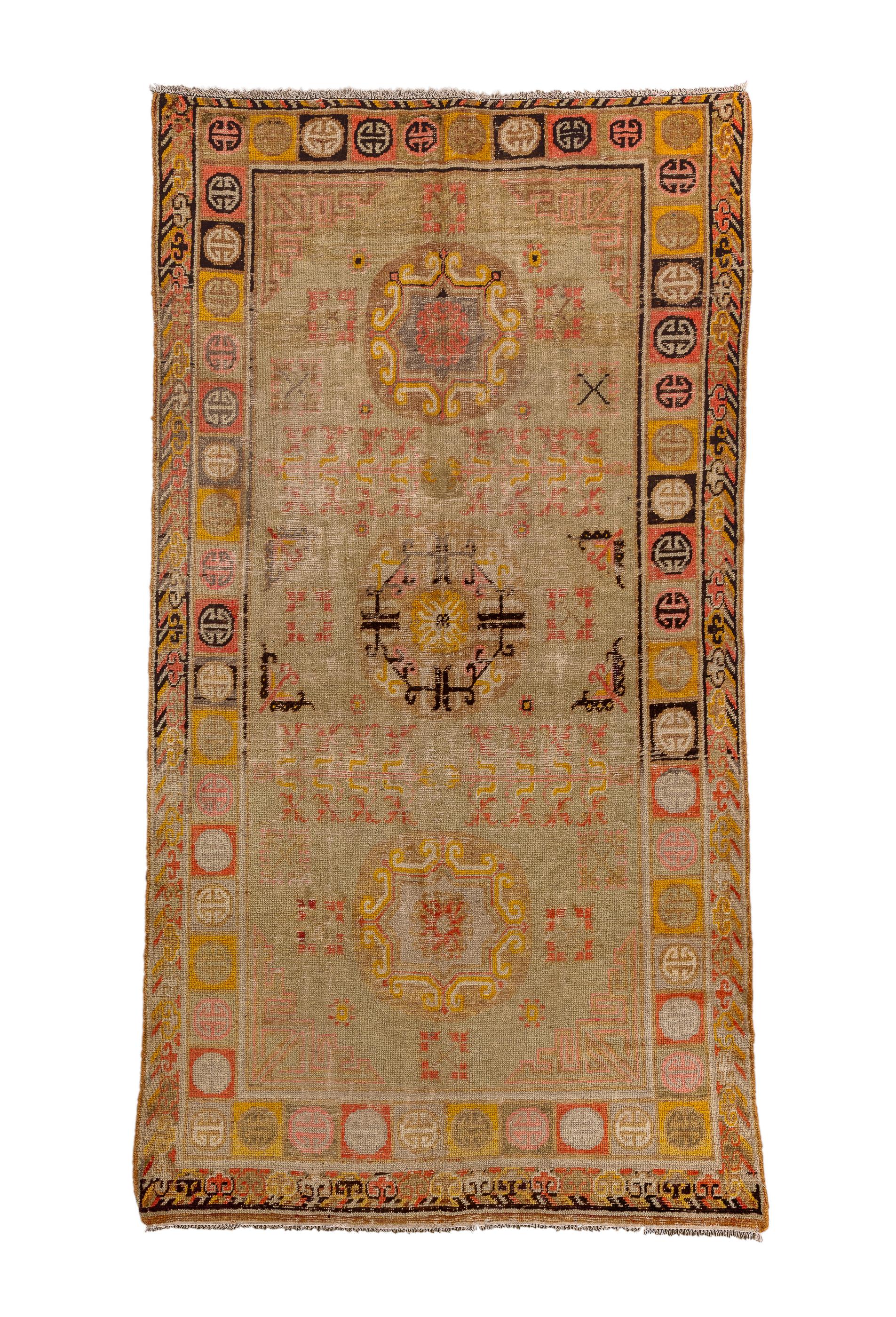 The straw beige field displays a characteristic three moon medallion pattern, with two moons enclosing octogramme motives.  Supporting scatter with butterflies, leaves and flower arrays.  Main border of squares  displaying simplified “Shou”