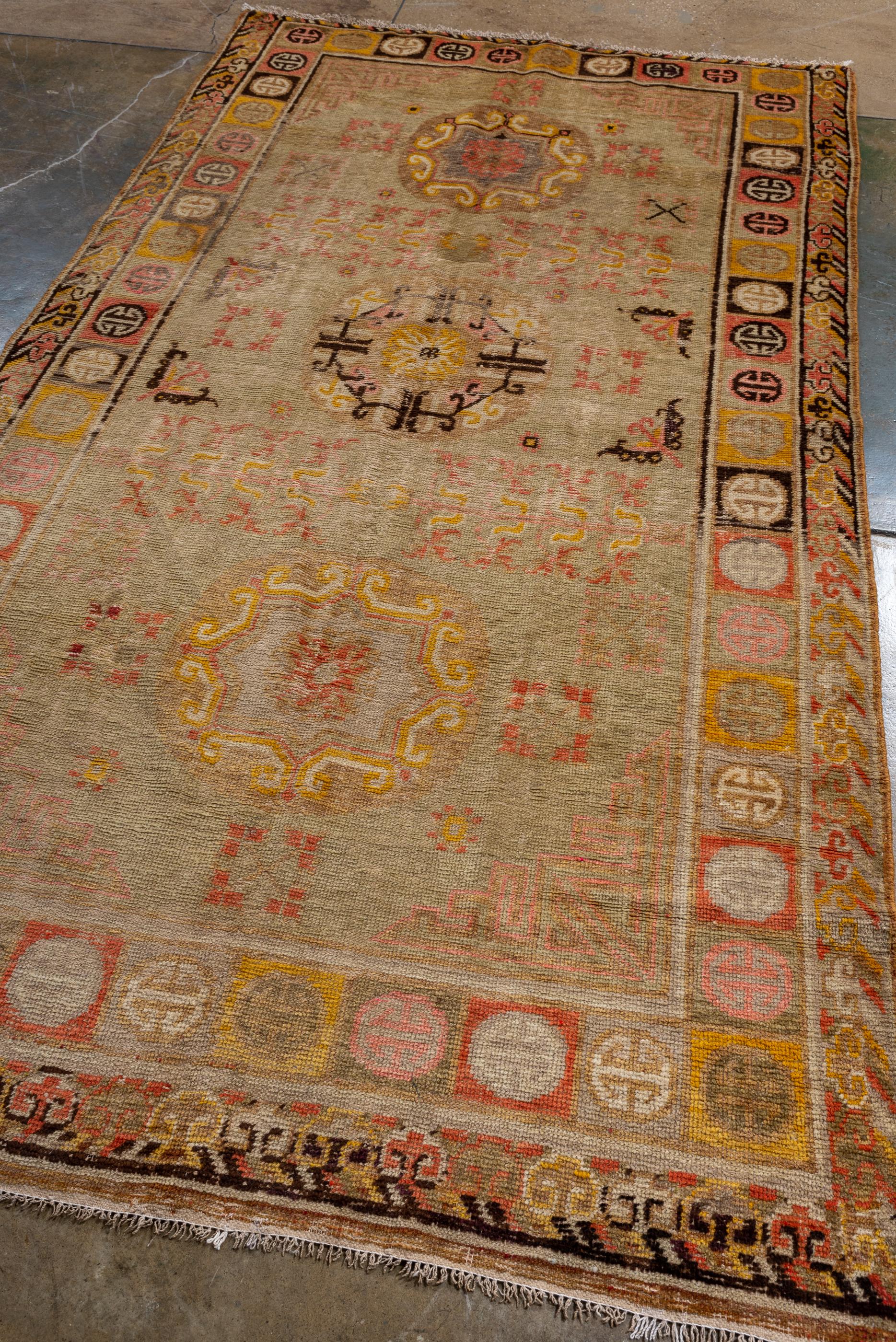 Chinese Antique Khotan Rug, with Straw Beige Field, and Moon Medallions For Sale