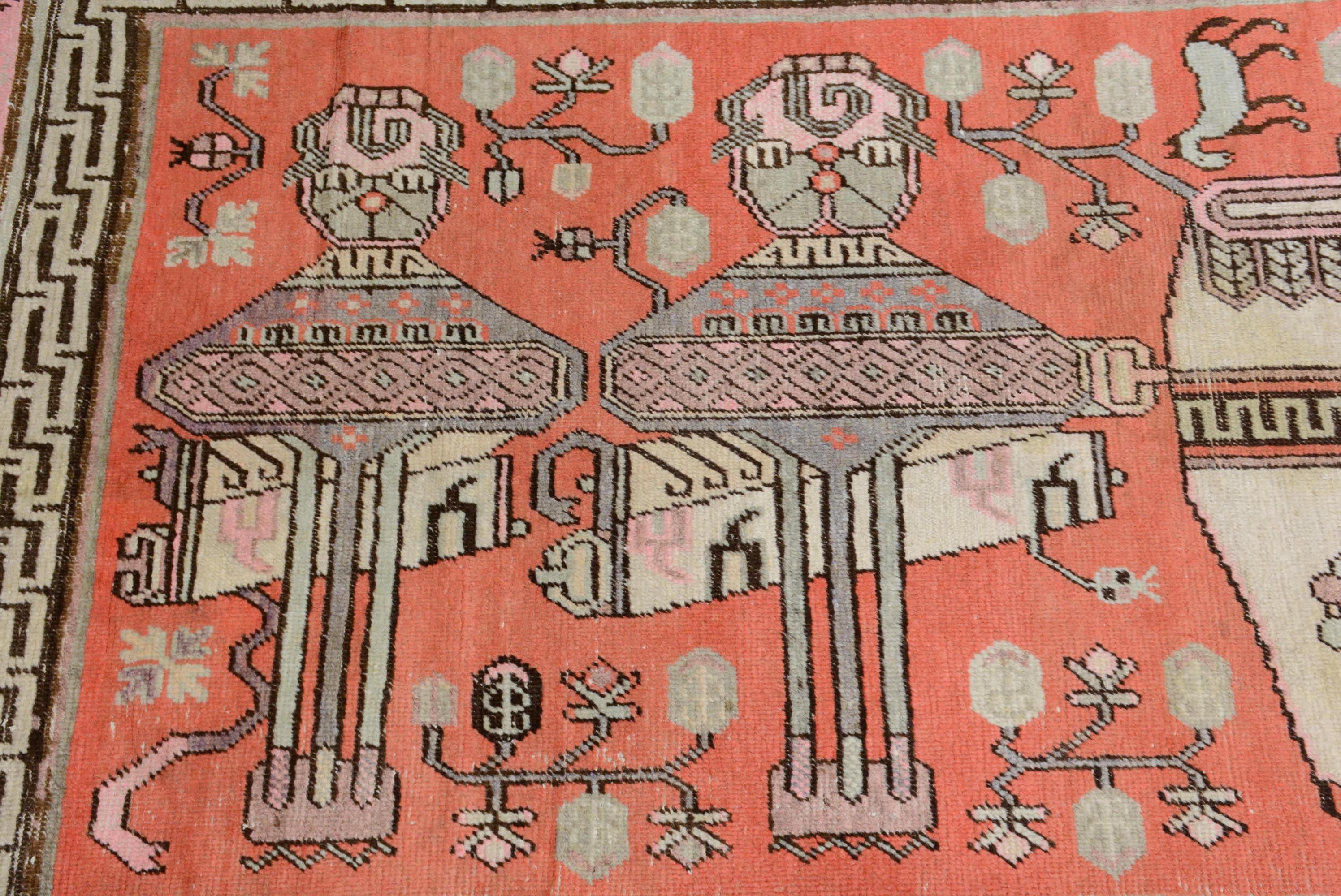 Khotan rugs are hand woven in Sinkiang province in western China, also referred to as East Turkestan. They are often called Samarkand rugs after the central Asian city where they were traded. Their patterns combine Chinese details with central Asian