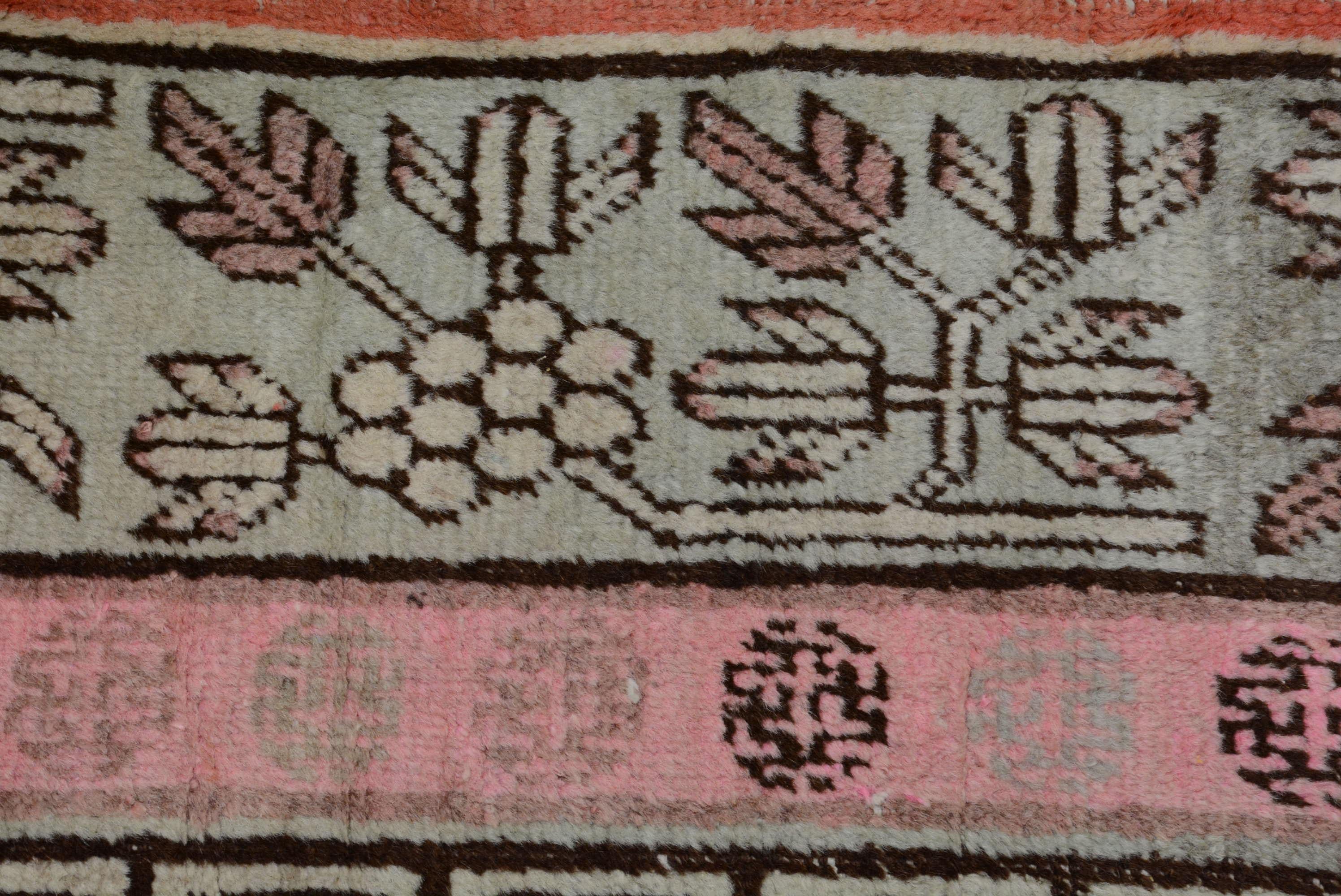 20th Century Antique Khotan Rug with Vase Pattern For Sale