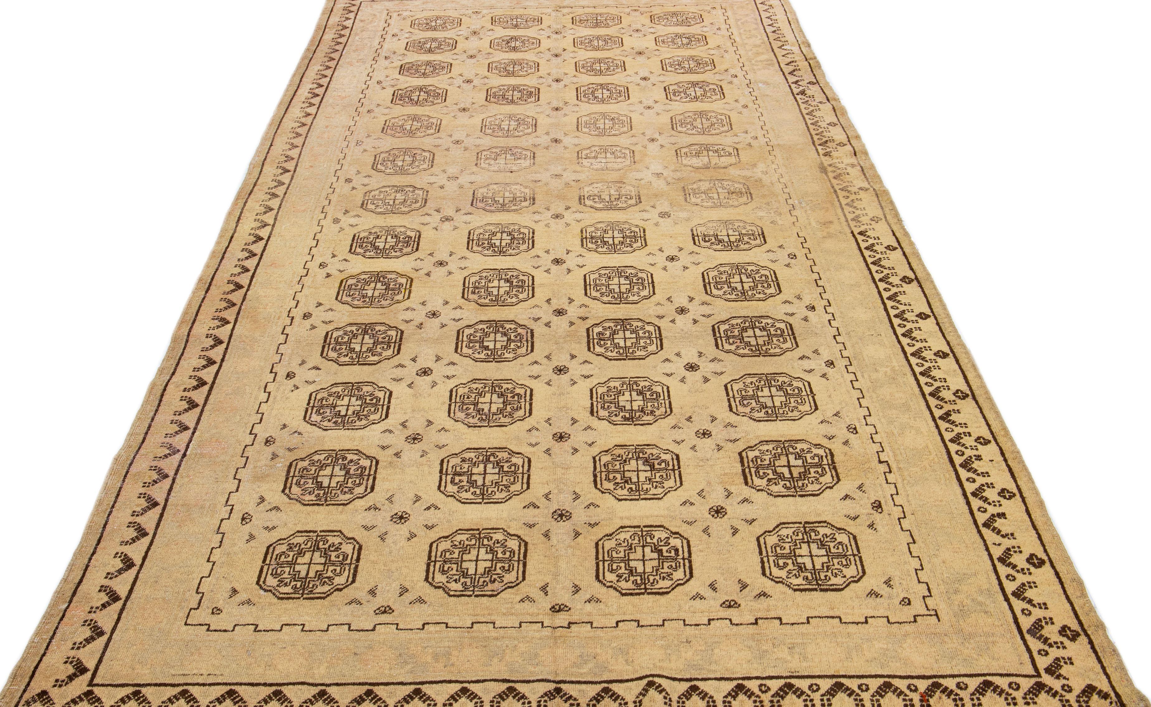 East Turkestani Antique Khotan Tan Handmade Geometric Pattern Wool Rug For Sale