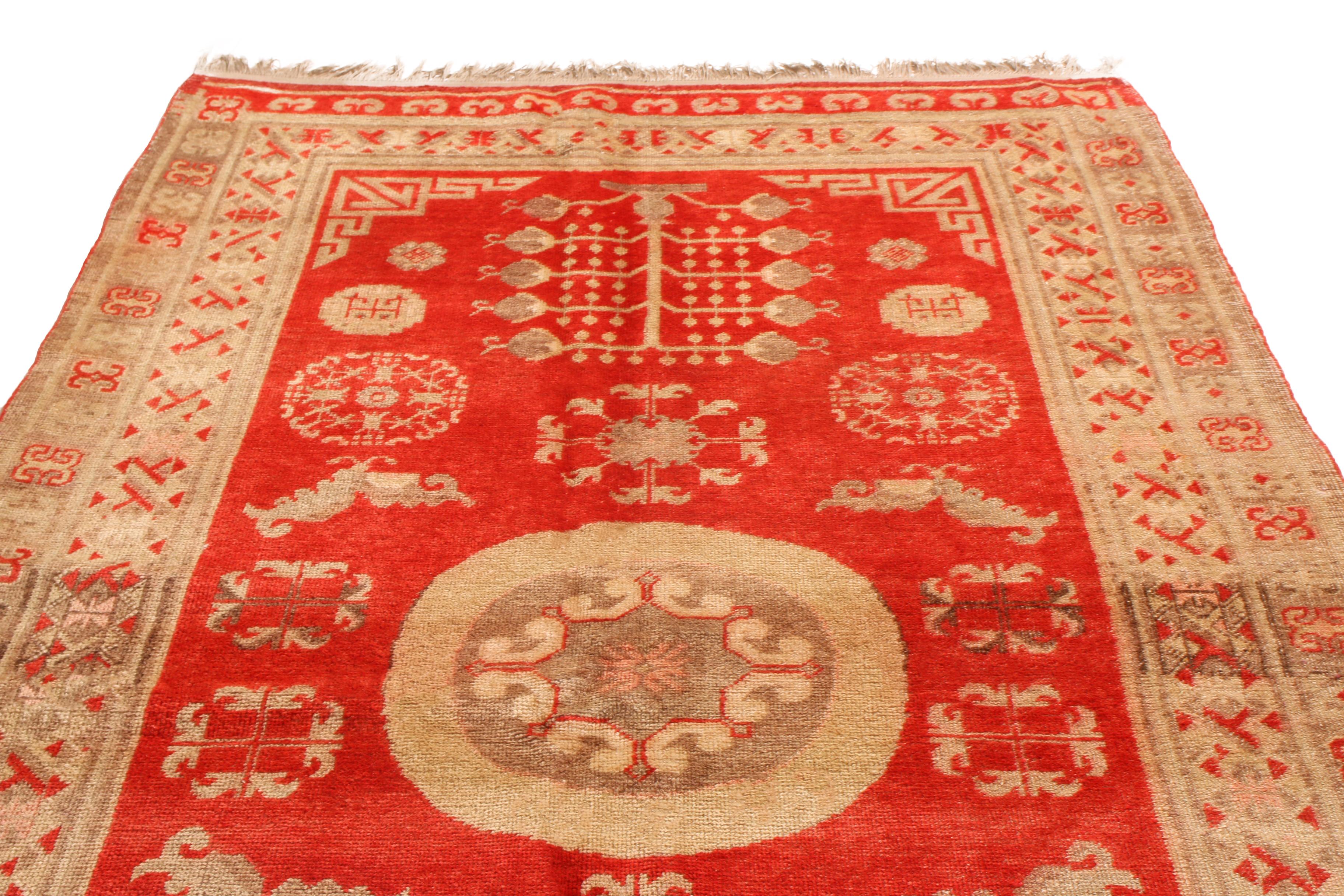 Originating from East Turkestan between 1920-1940, this antique transitional Khotan rug from Rug & Kilim has a medallion-style field design with key cultural imagery from the region. Handwoven in high-quality wool, the medallion field design employs