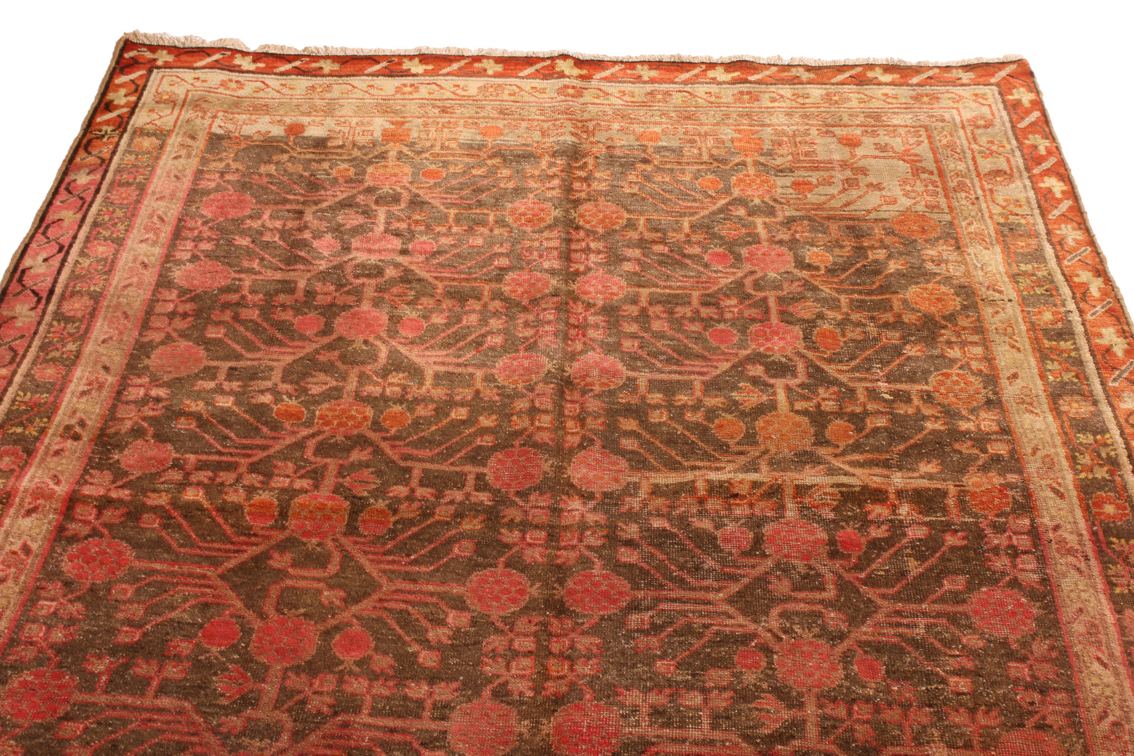 Originating from East Turkestan in 1920, this antique transitional Khotan rug from Rug & Kilim marries distinguished regional symbolism with a unique color orientation. ¬Hand woven in high quality wool, the field design depicts rich, finely woven