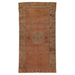 Ancien tapis Khotan avec médaillon central stylisé