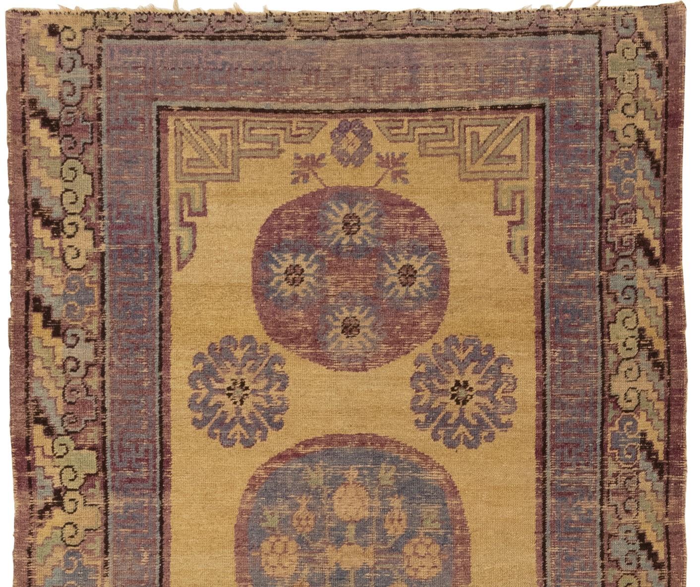 This antique Khotan rug from East Turkistan is truly stunning. It's clear that a lot of care and attention went into its creation around 1900, and the circular three medallions with more circular patterns inside and out are a real highlight. I love