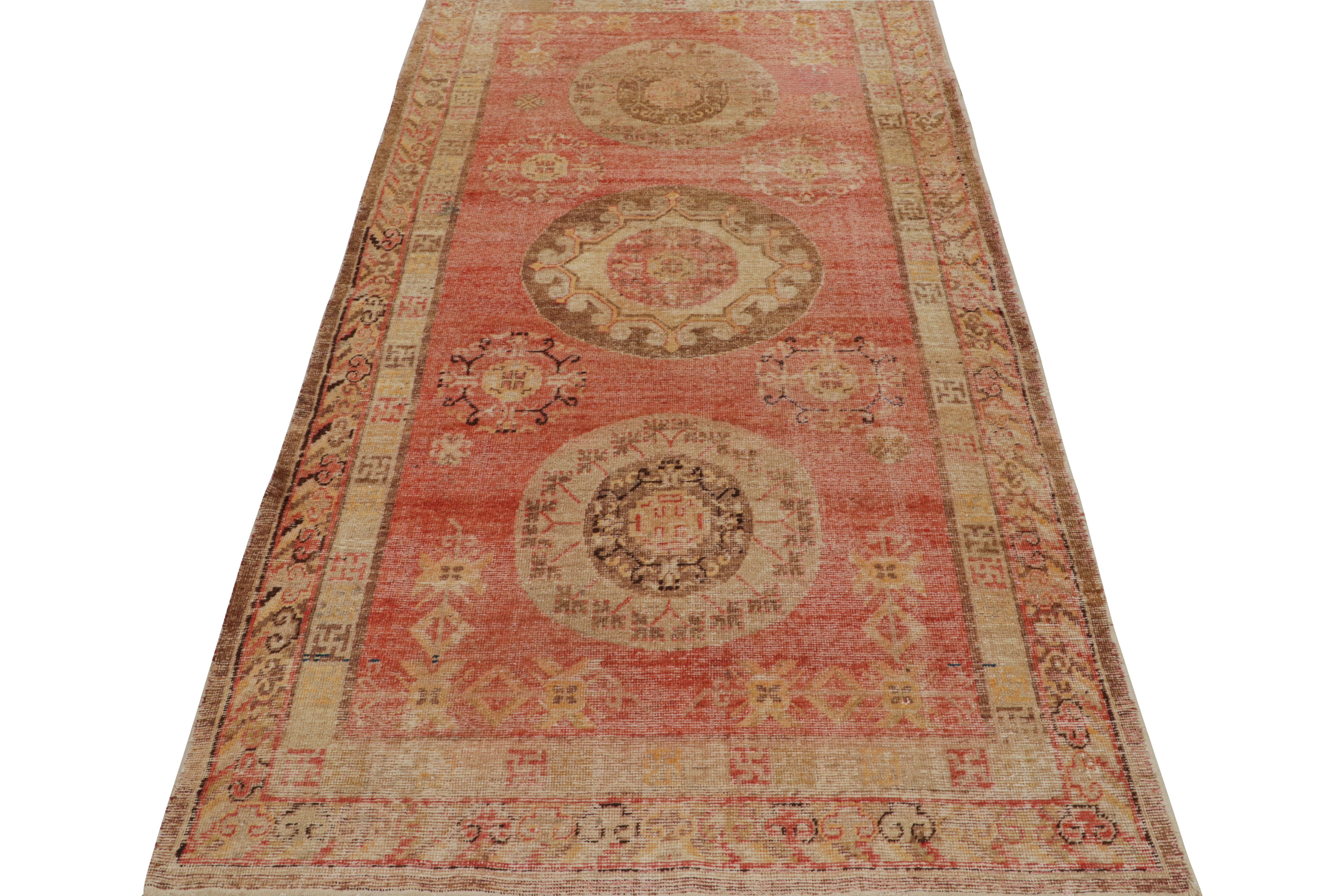 East Turkestani Antique Khotan Wool Rug in Red and Beige Geometric Pattern by Rug & Kilim For Sale